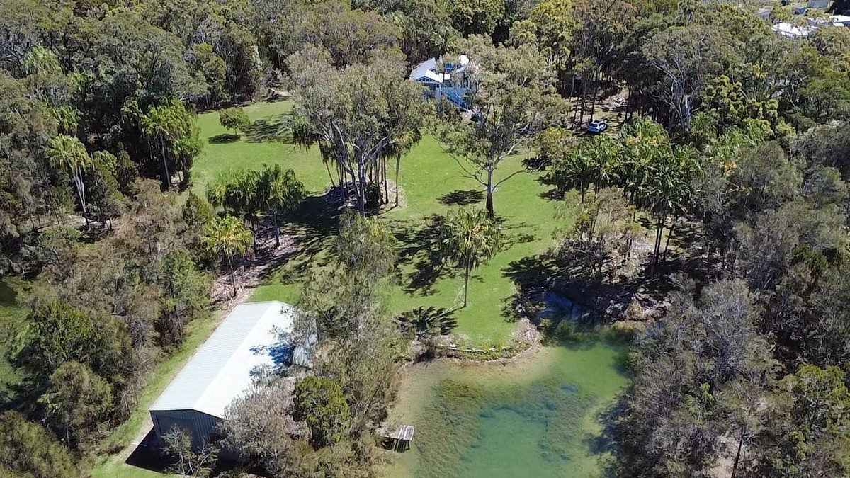 Rare Acreage Coastal Retreat with Private Lakes & Jetty!!