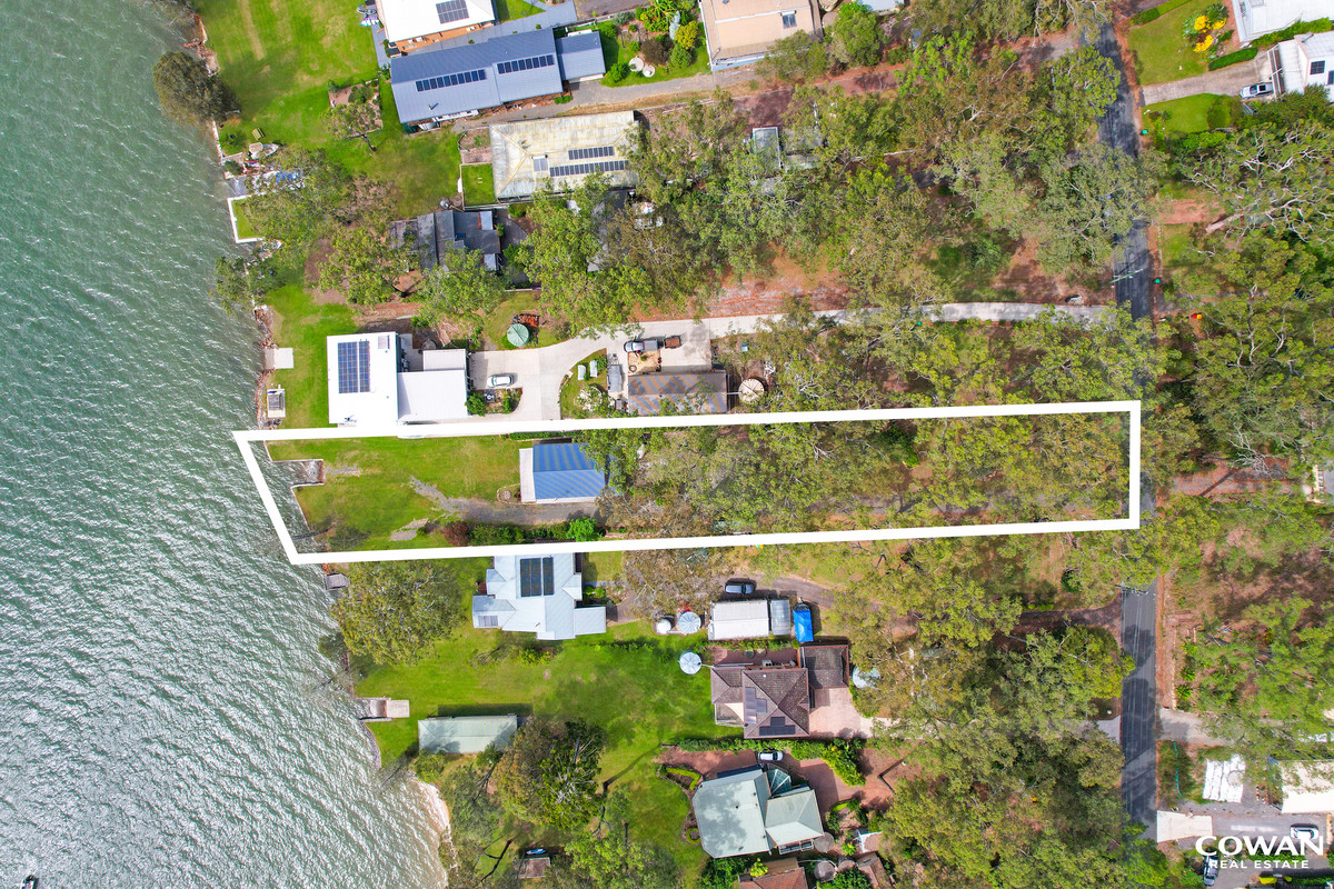 Absolute Waterfront on the Pristine Waters of North Arm Cove | Private Boat Ramp & Dual Dwelling Potential