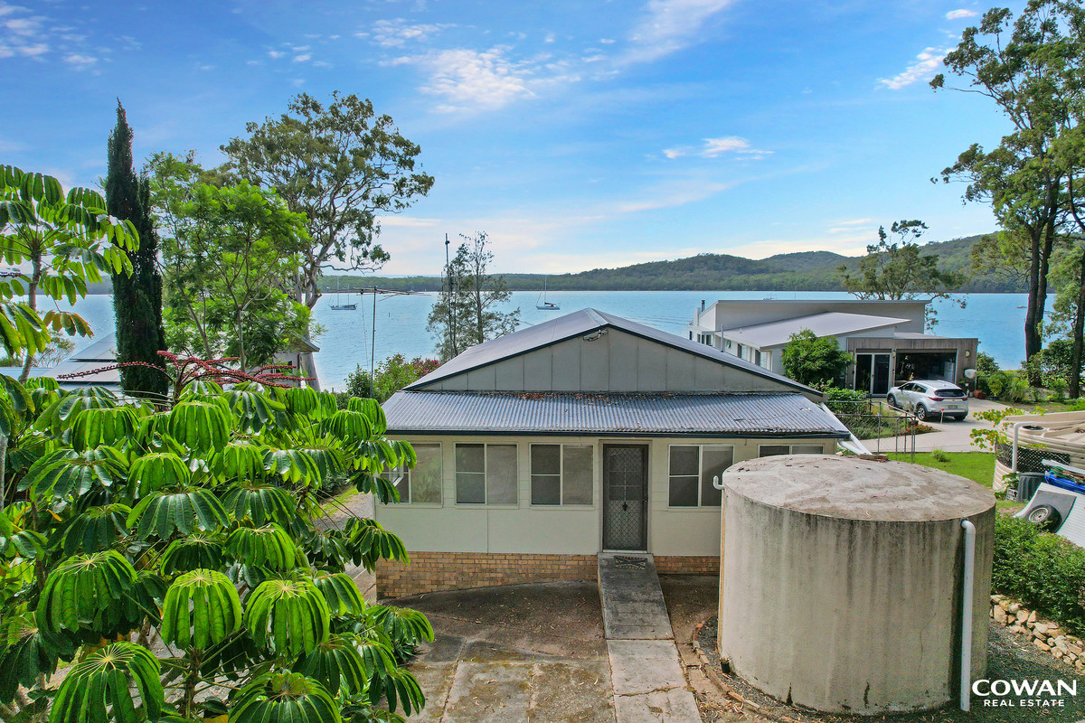 Absolute Waterfront on the Pristine Waters of North Arm Cove | Private Boat Ramp & Dual Dwelling Potential