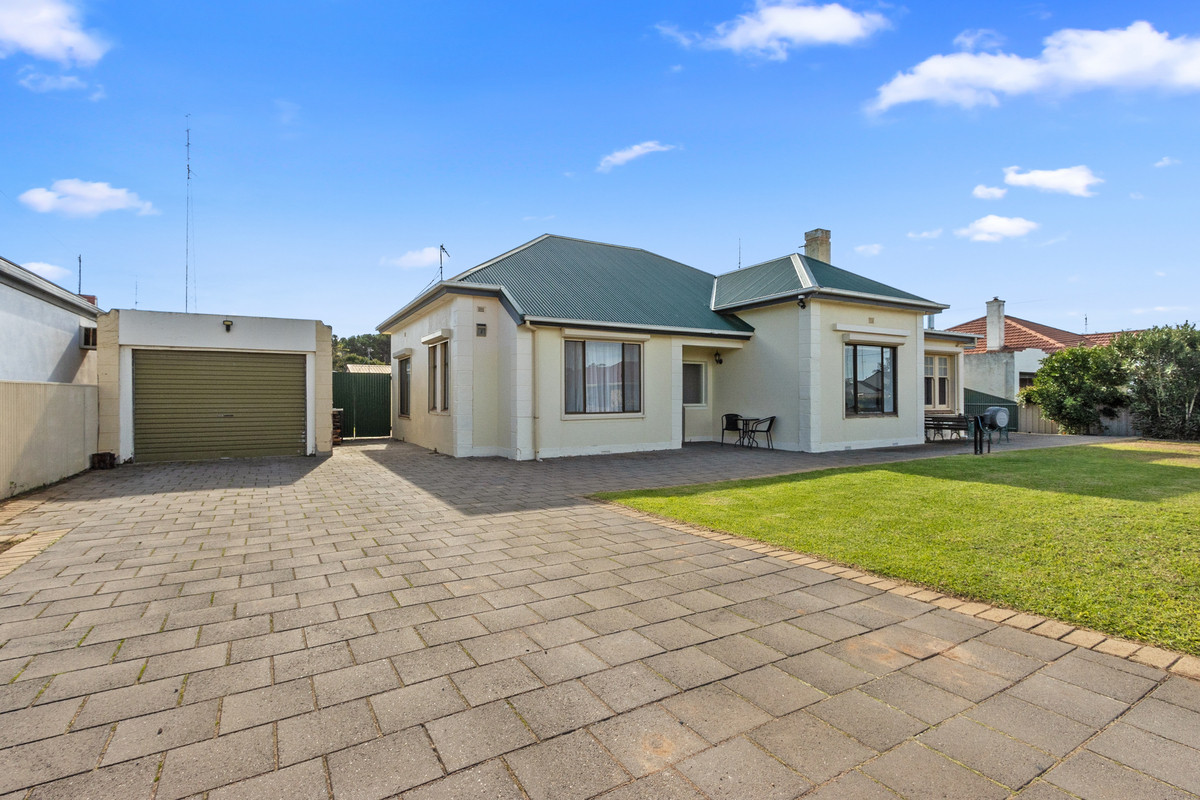 Four-Bedroom Home with Solar, Roller Shutters & Central Location