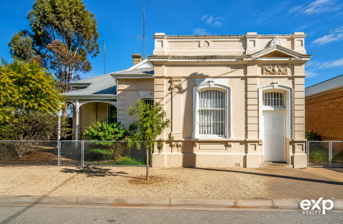 Leased & Loaded — The Historic Brinkworth Bank with Big Returns & Commercial Upside