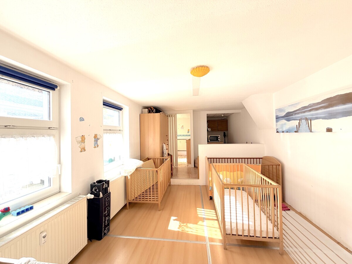 Geschäfts- und Wohnhaus in zentraler Lage