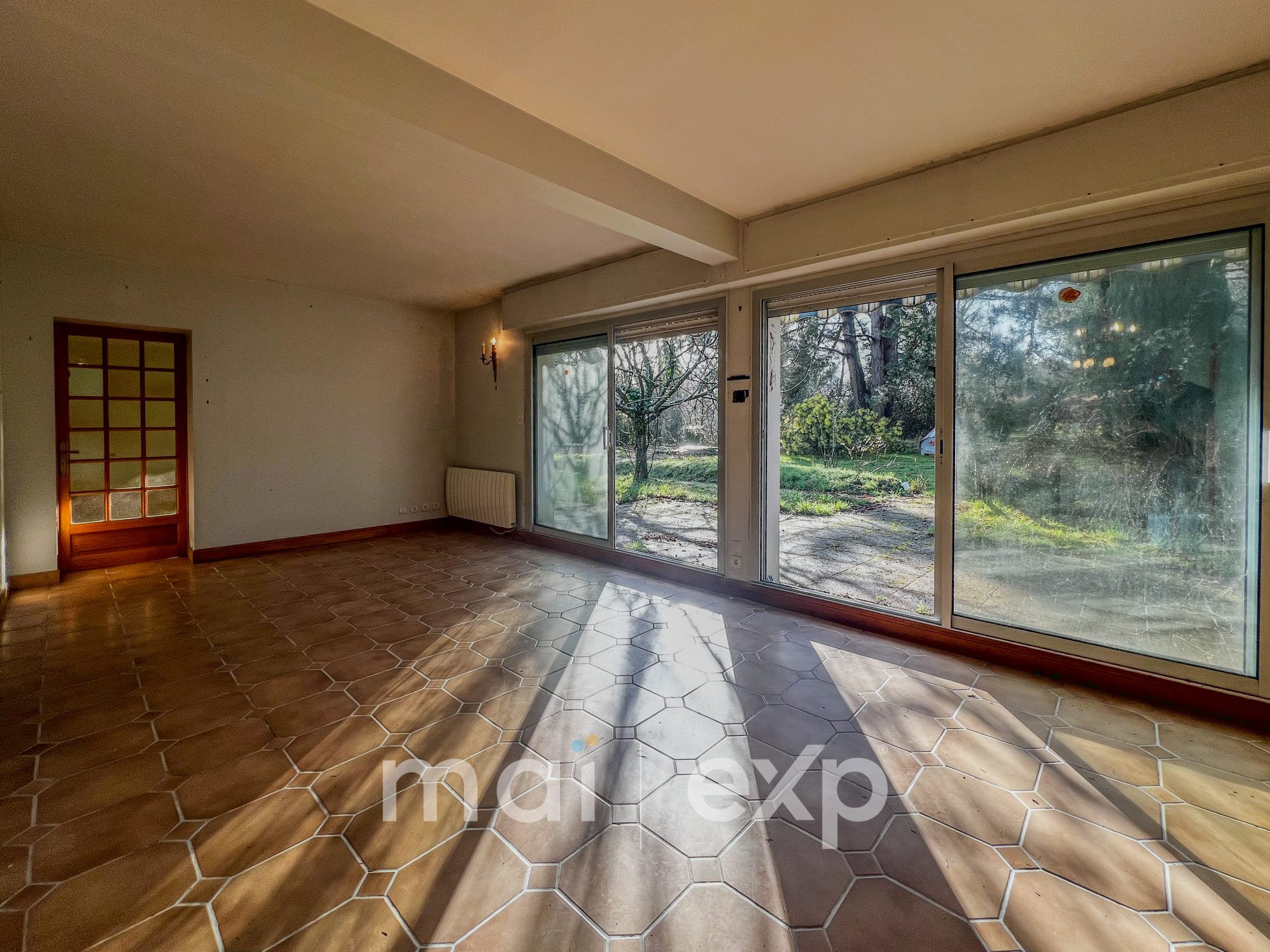 Appartement T2/T3 en rez-de-chaussée – 56 m² – Jardin 65 m² – 1 stationnement