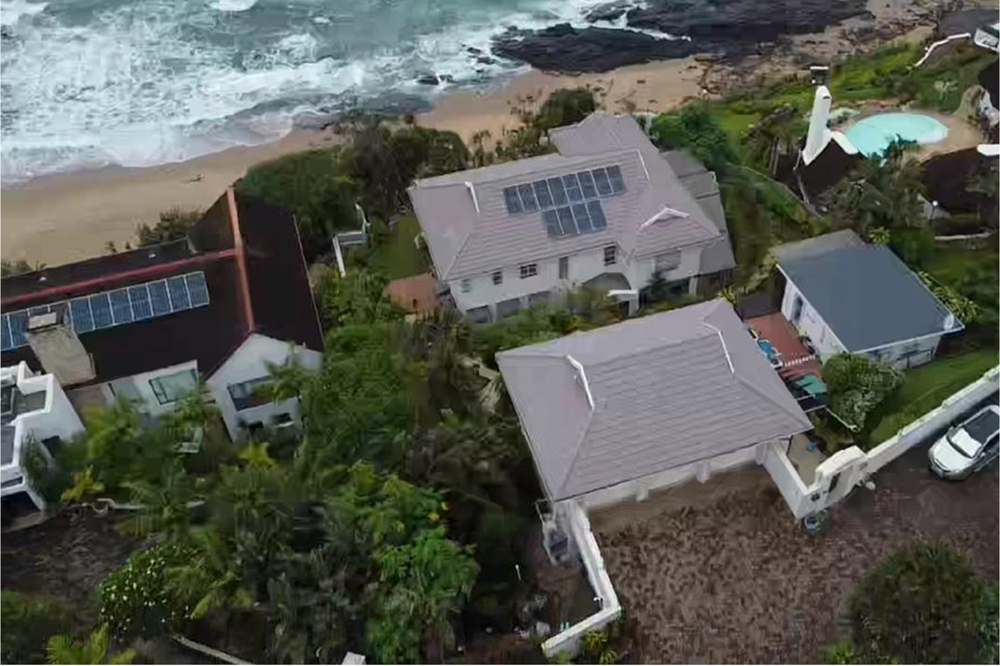 Accepting Reasonable Offers -Stunning Beachfront Home with Three Income Generating Apartments