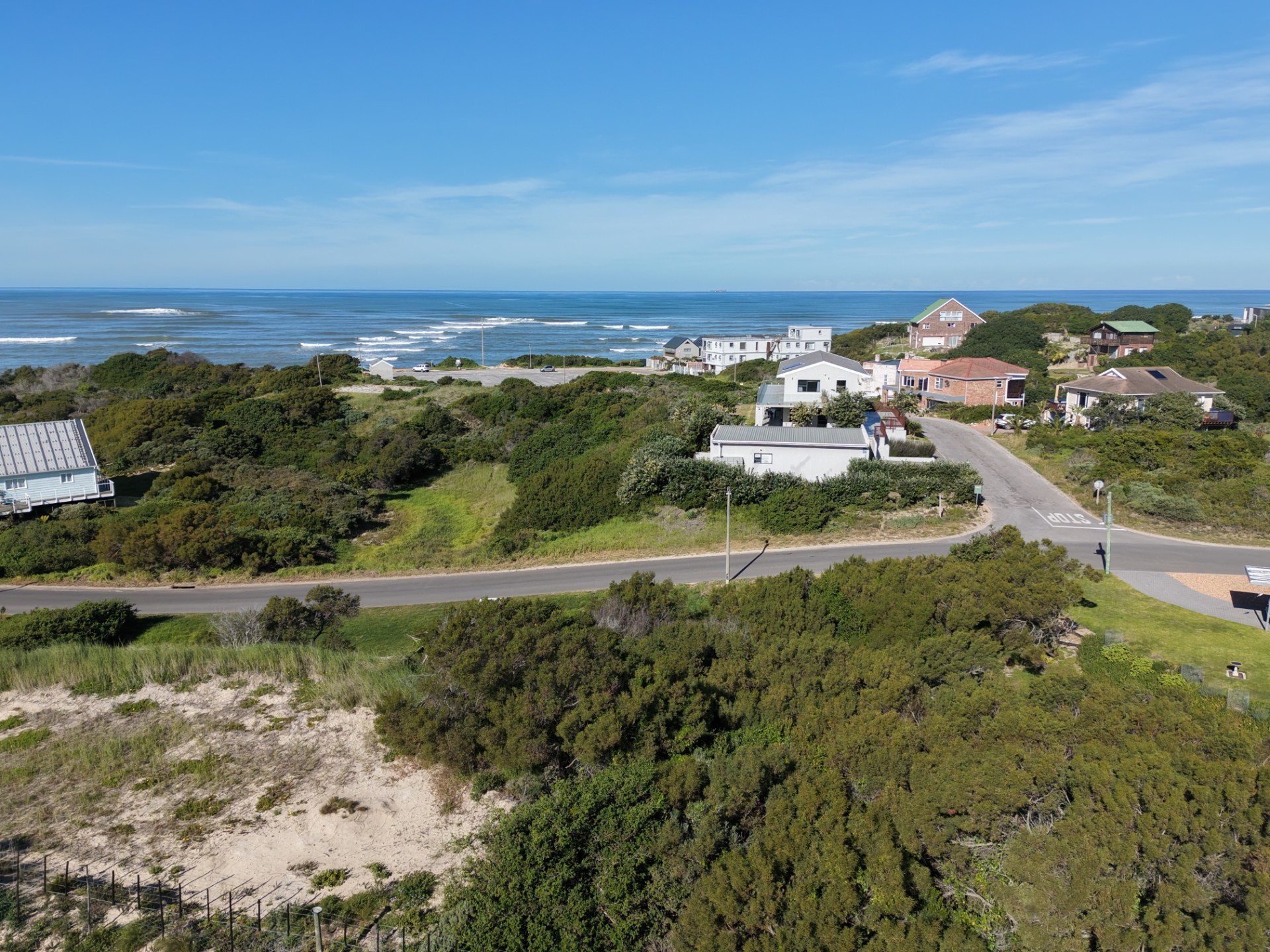 Plot for sale in Paradise Beach with distant sea view