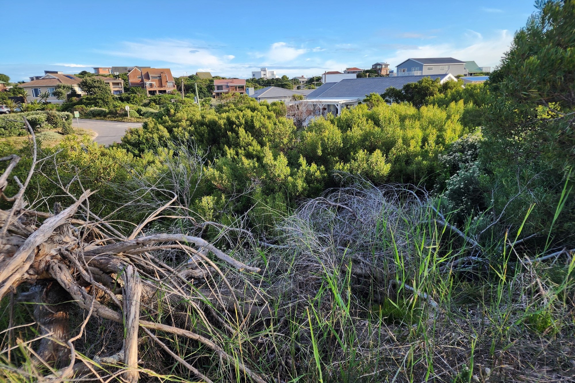 Plot for sale in Paradise Beach with distant sea view