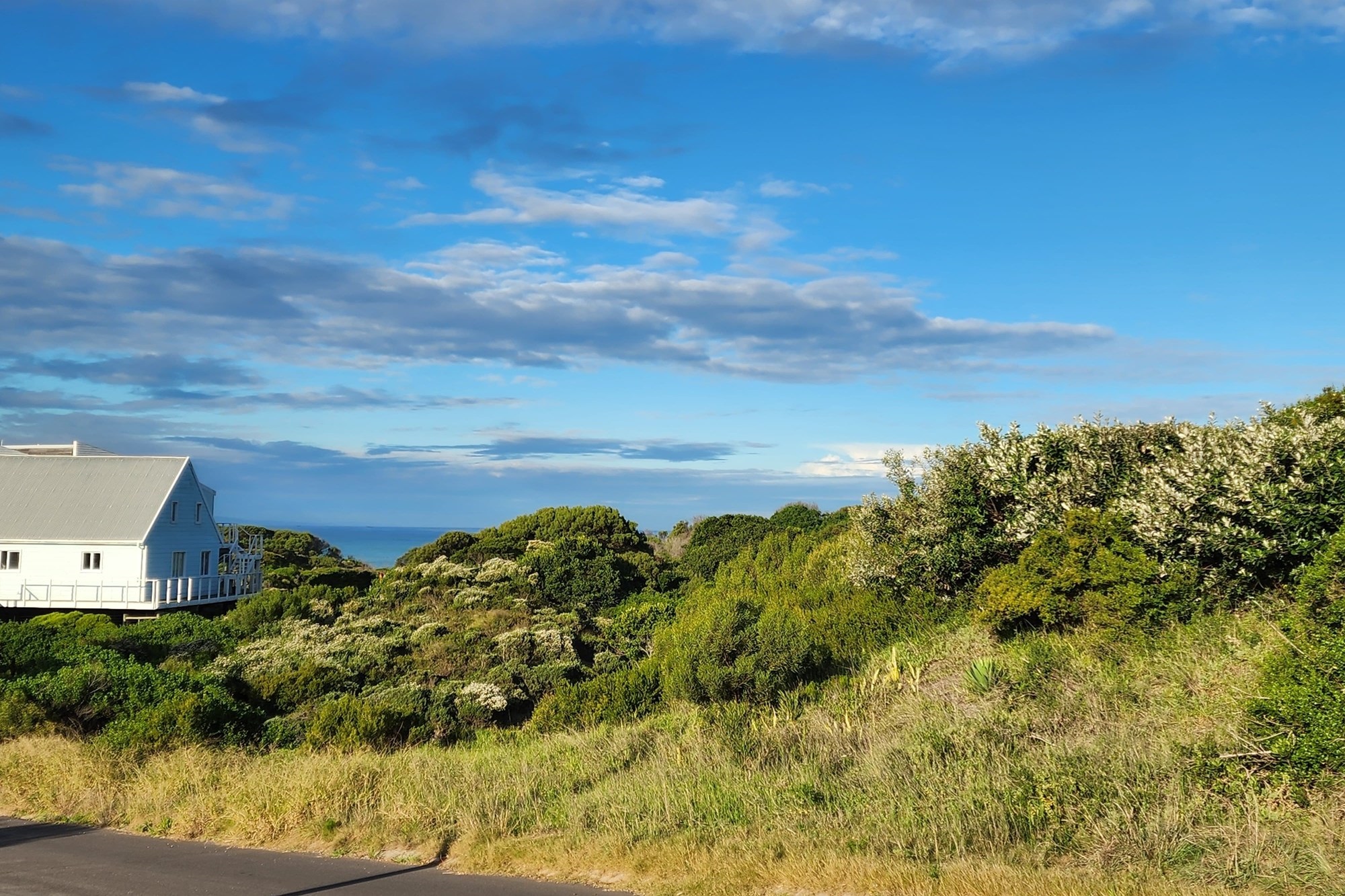 Plot for sale in Paradise Beach with distant sea view