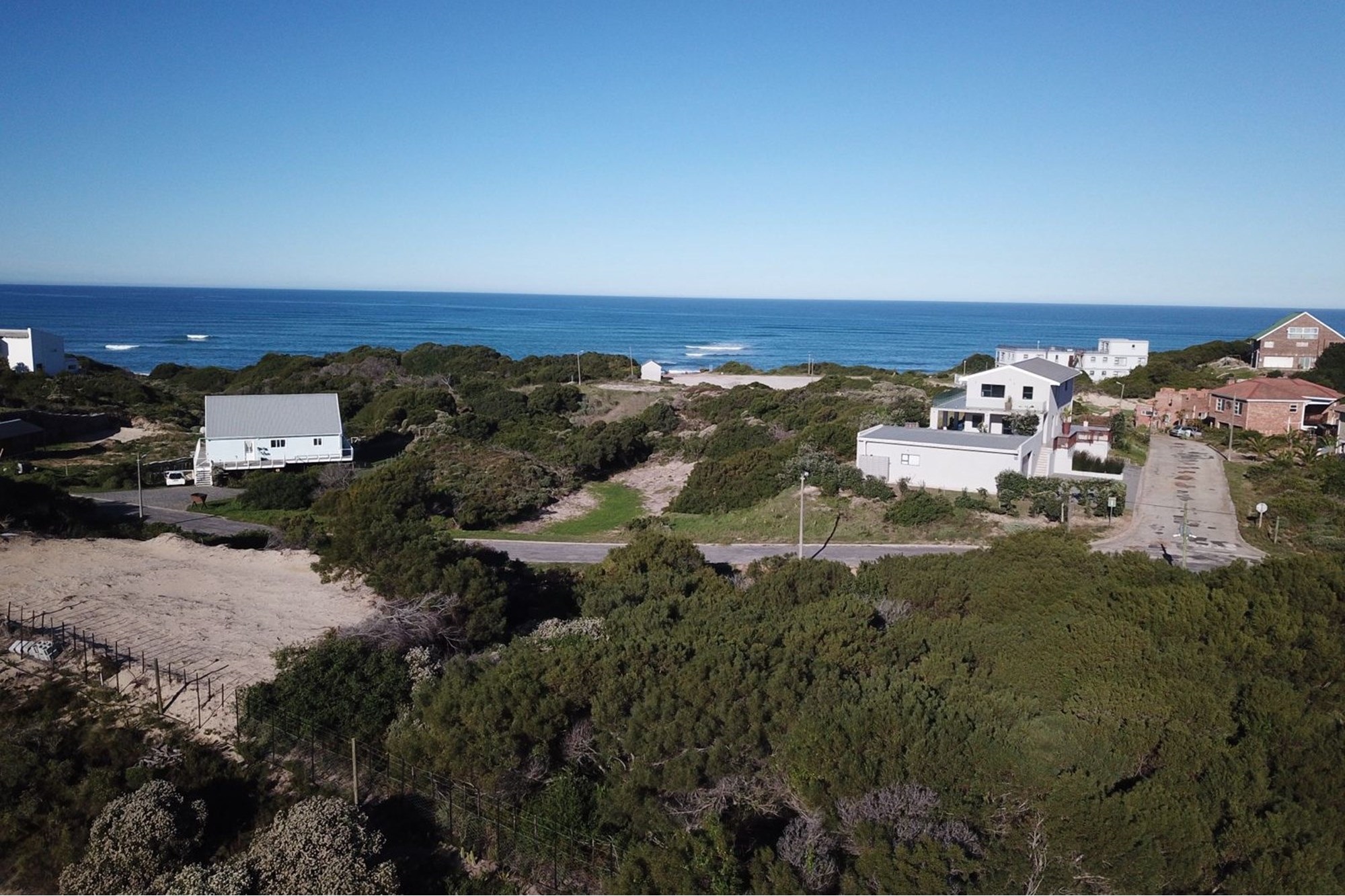 Plot for sale in Paradise Beach with distant sea view