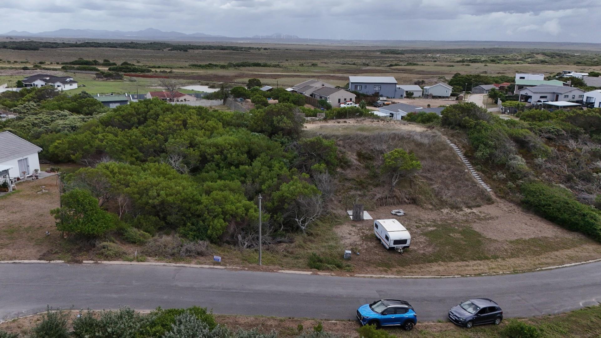Plot for sale in Paradise Beach with distant sea view