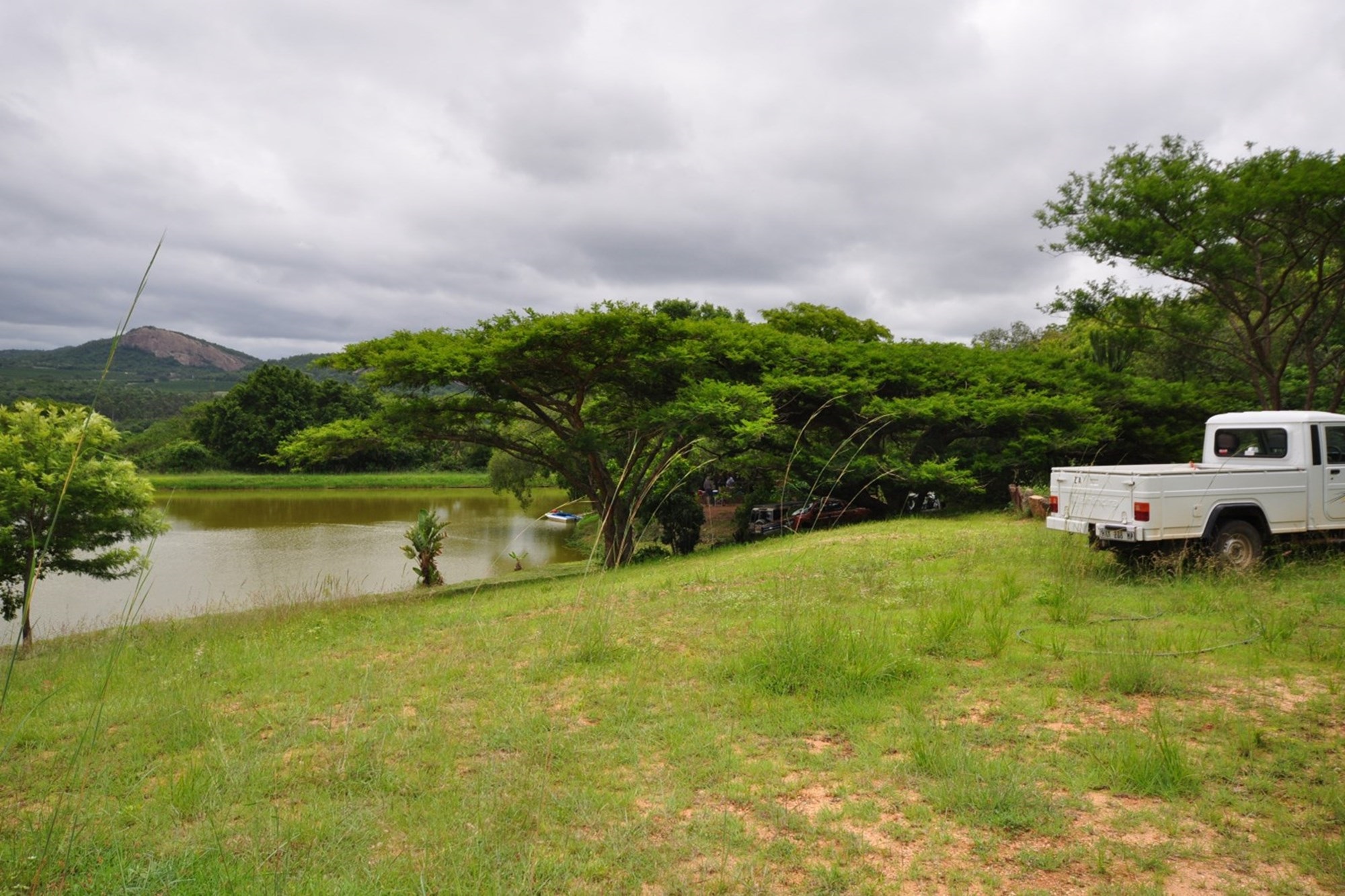Scenic farm with hills and dam close to Karino