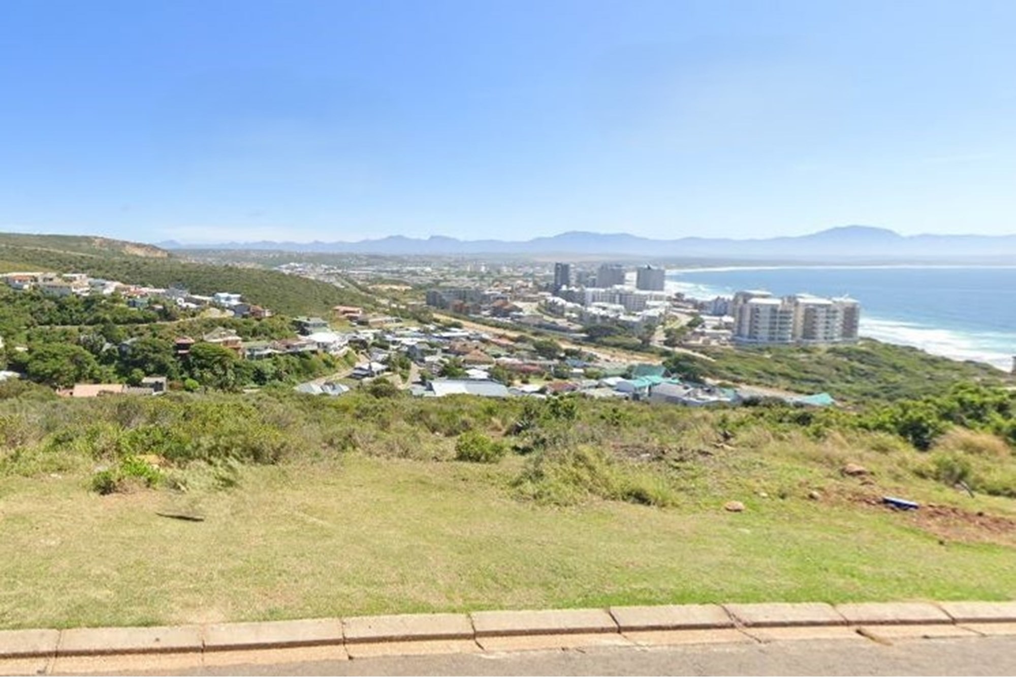 This plot offers breathtaking valley and sea views that promise serene and picturesque living