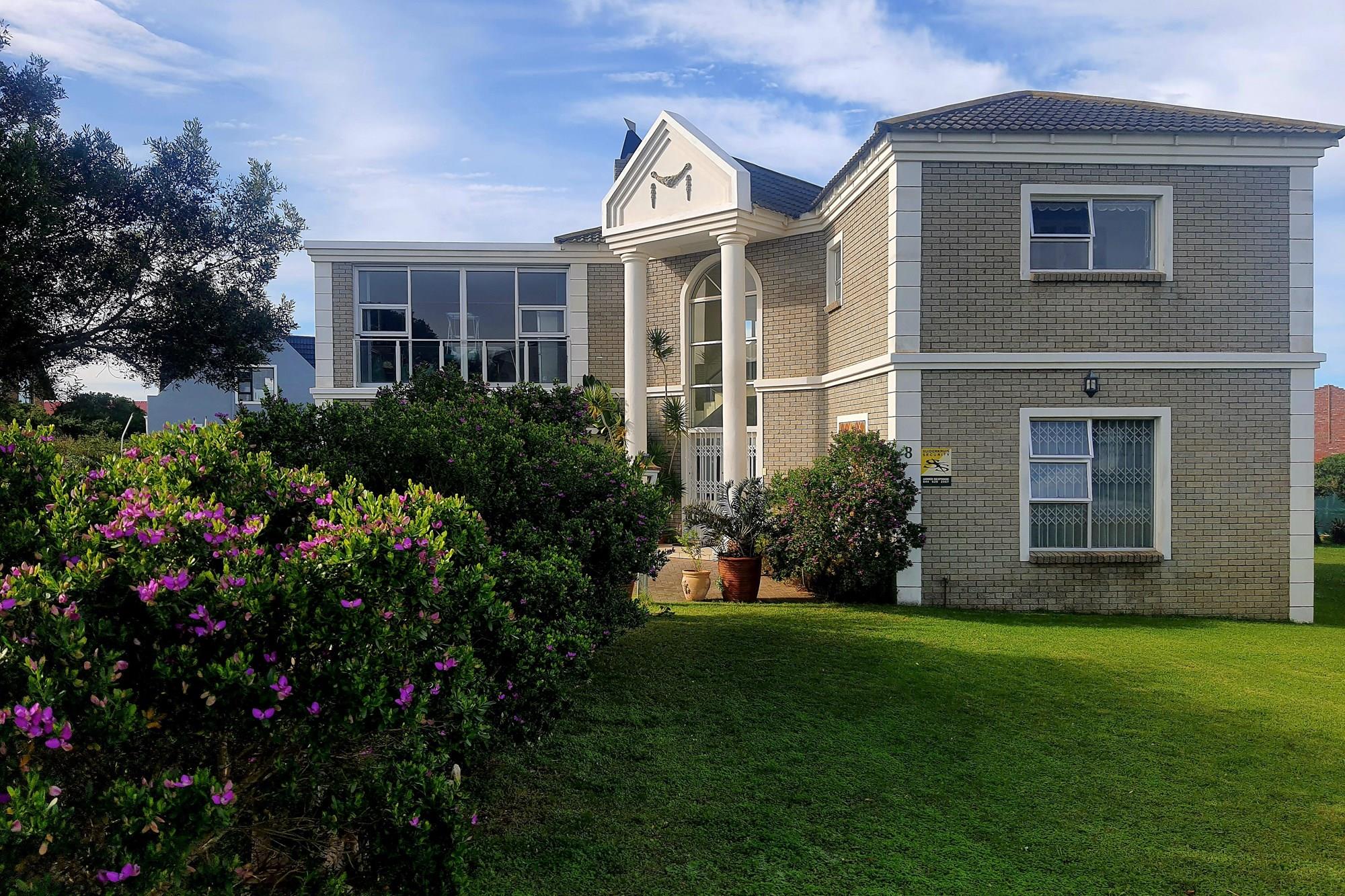 Elegant Double-Story Home with Sea Views