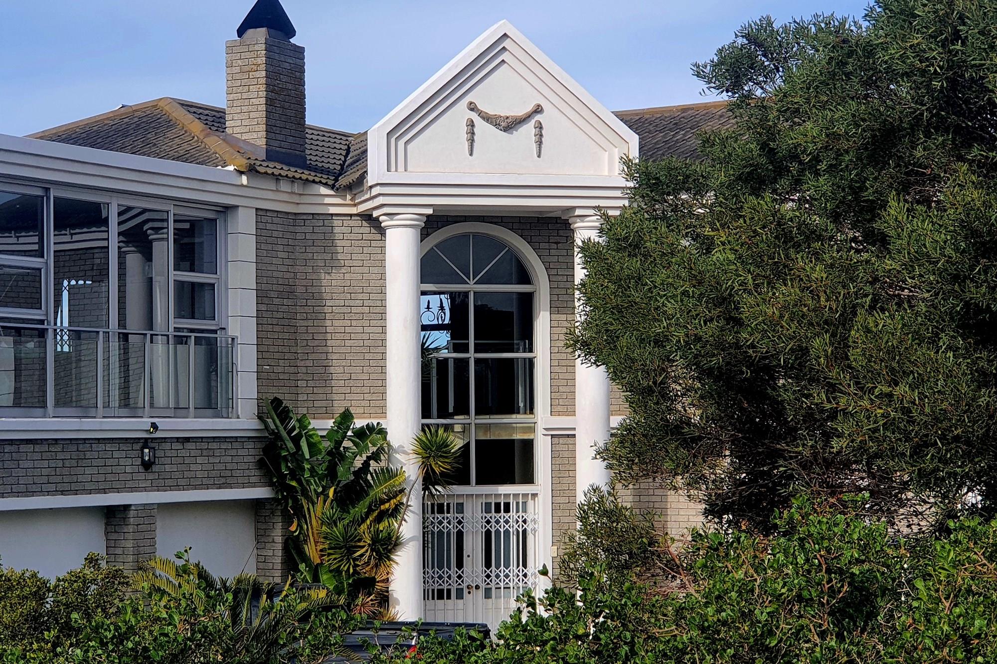 Elegant Double-Story Home with Sea Views