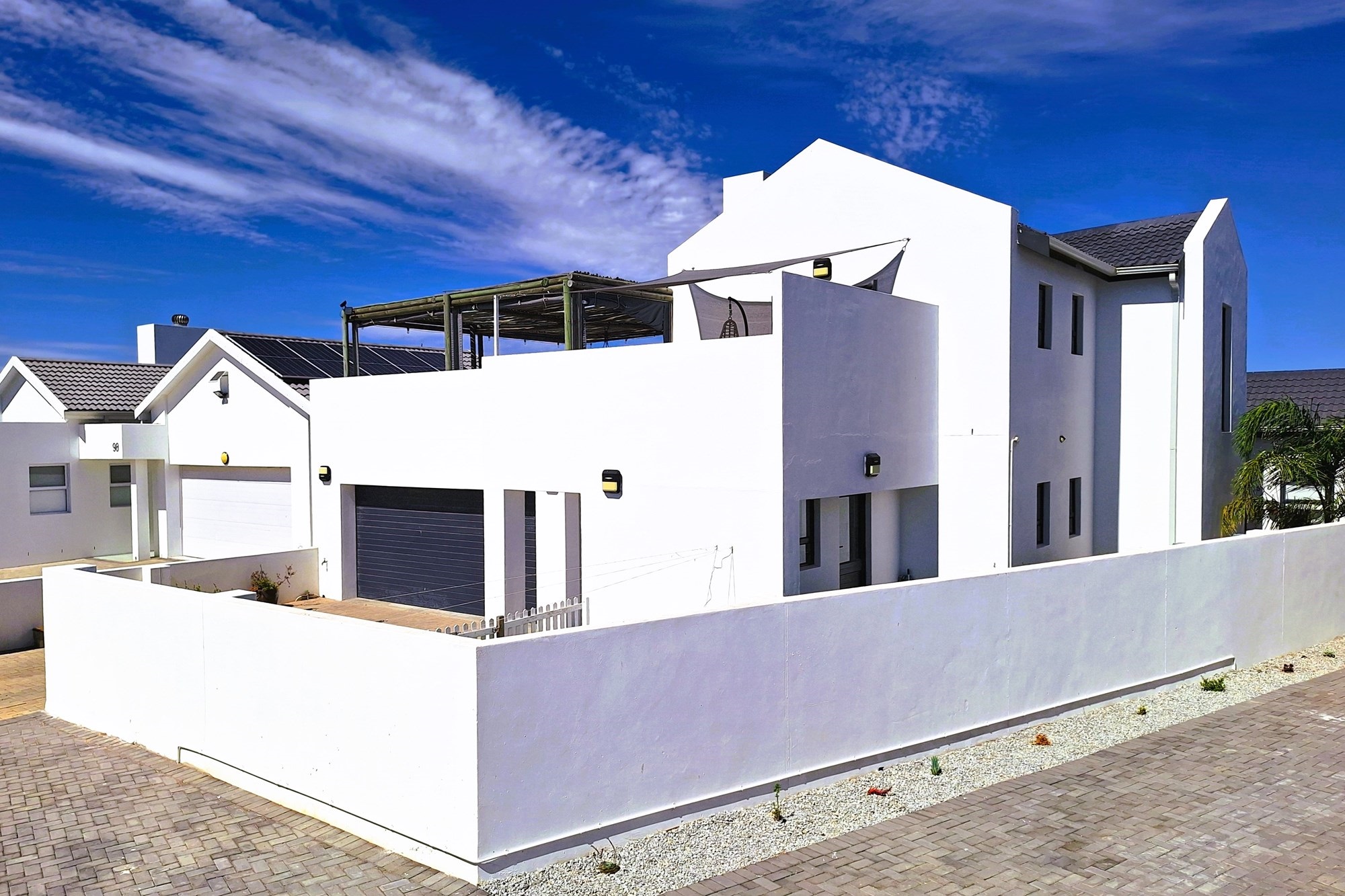 Estate Living at its finest: Stylish, Secure, Serene with partial Ocean Views.