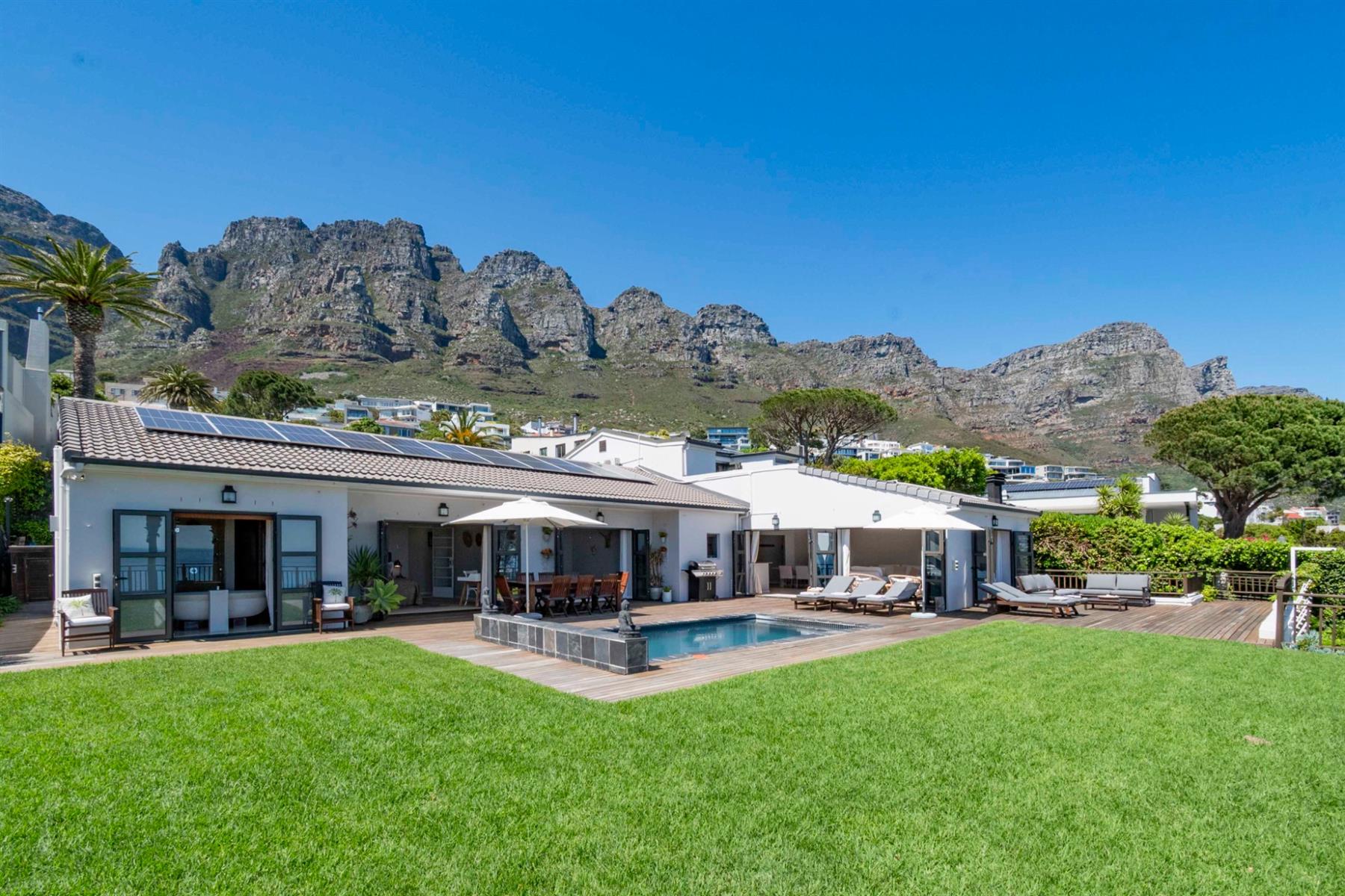 Experience Panoramic Ocean Sunsets from this 6 bedroom, 6 bathroom home