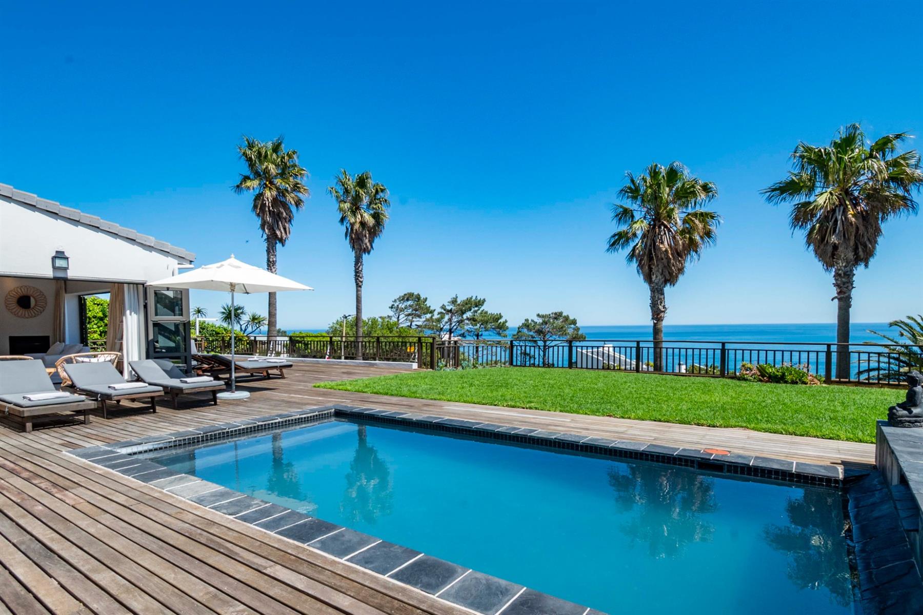 Experience Panoramic Ocean Sunsets from this 6 bedroom, 6 bathroom home