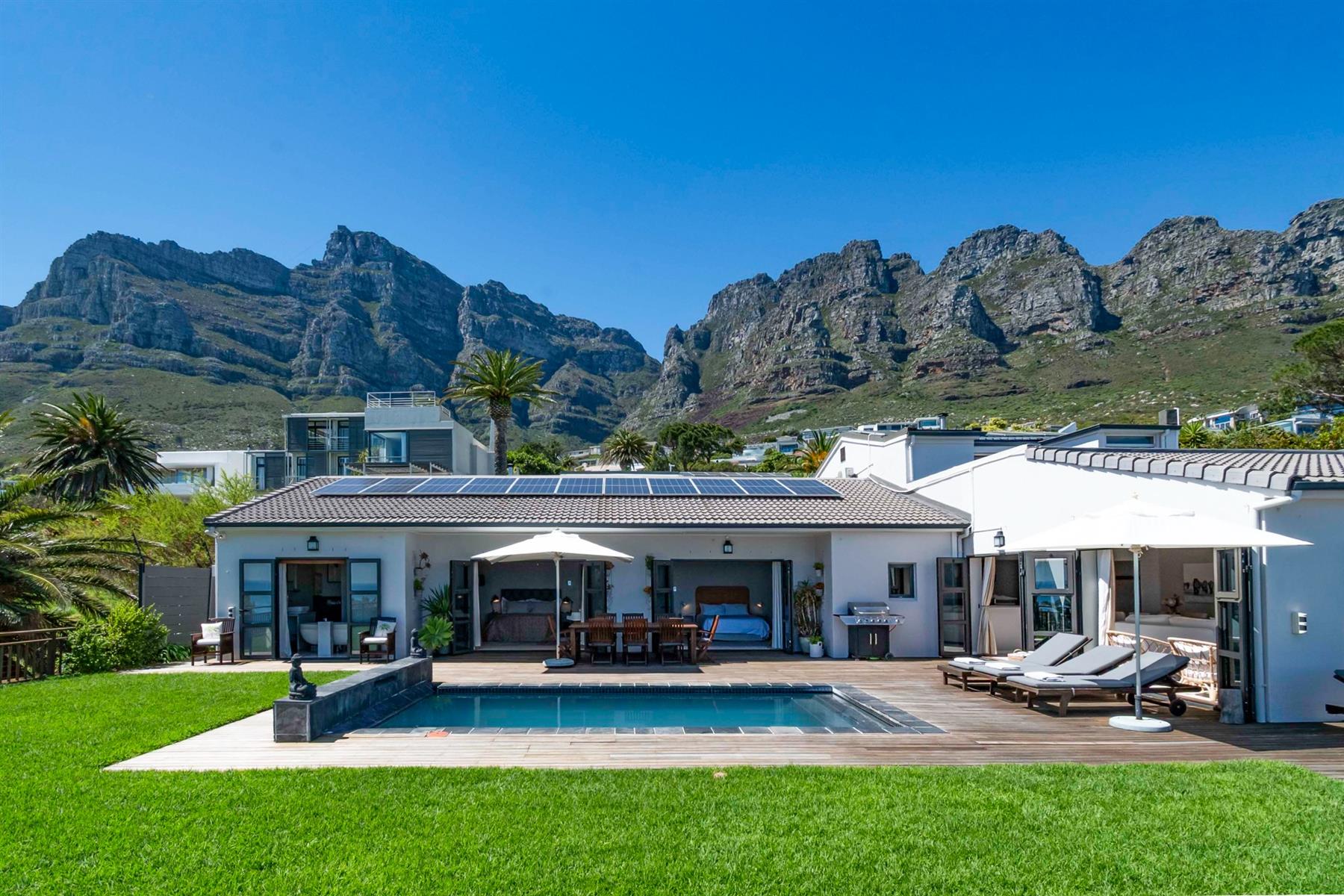 Experience Panoramic Ocean Sunsets from this 6 bedroom, 6 bathroom home