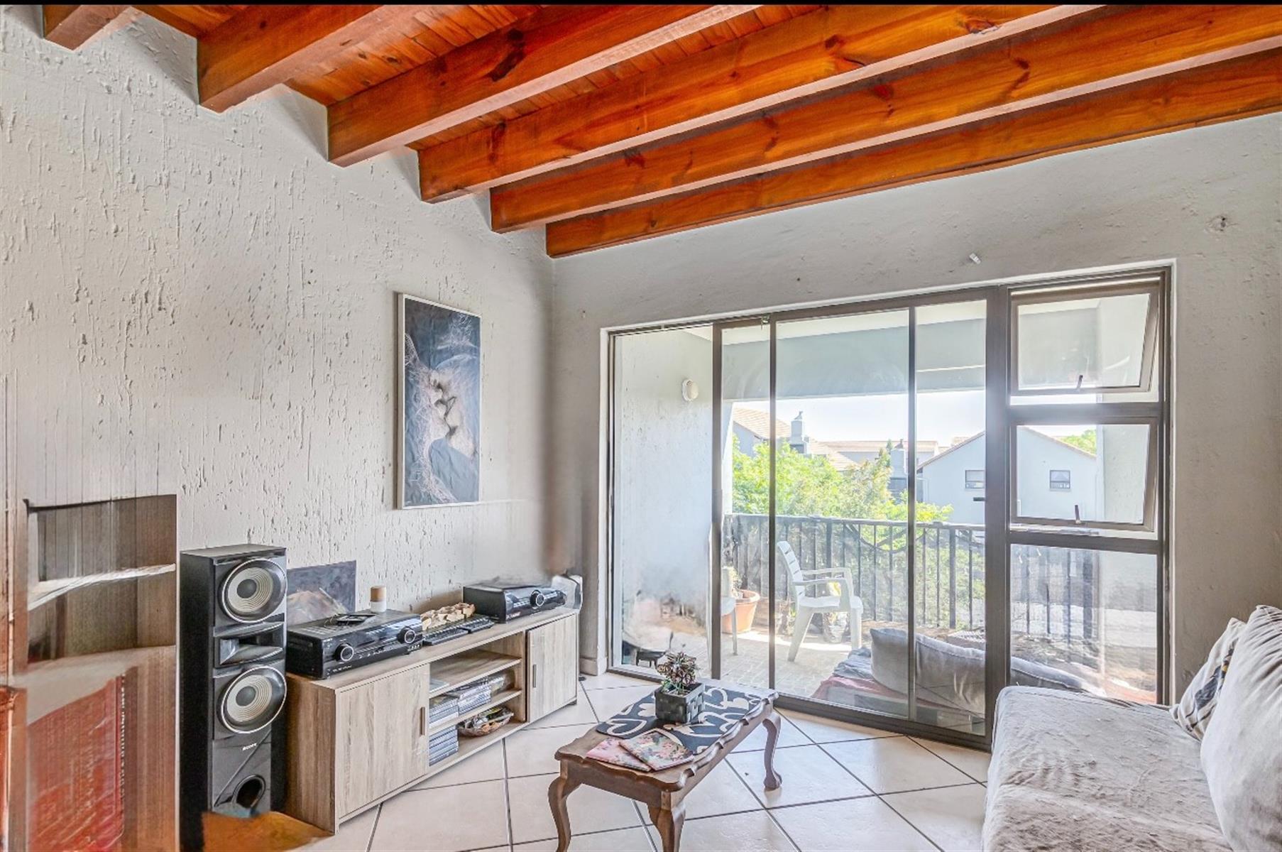 Duplex Apartment For Sale in Paulshof Sandton - 2 bed 2 bath, gas stove, 3 balconies, built-in braai