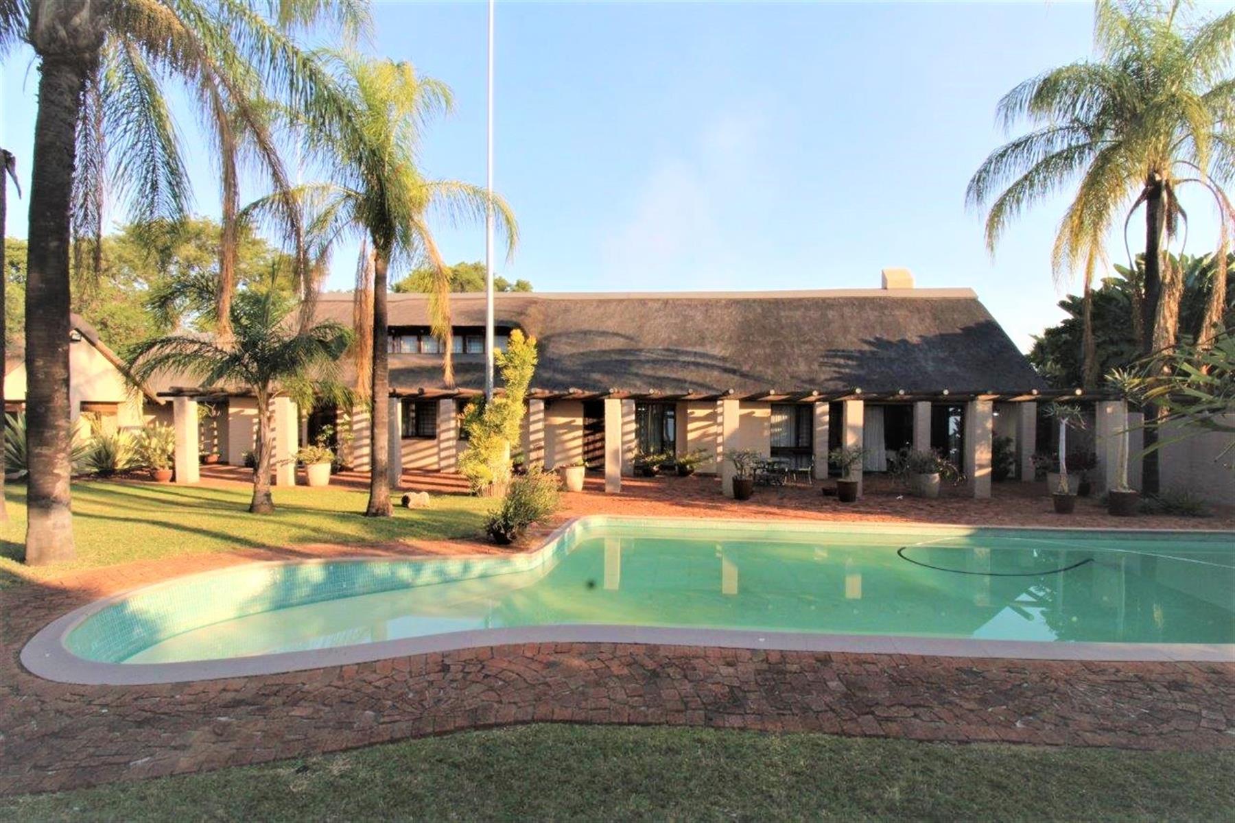 DOUBLE-STOREY THATCH-ROOF HOME IN CENTRAL BELA-BELA- 5 Bedrooms