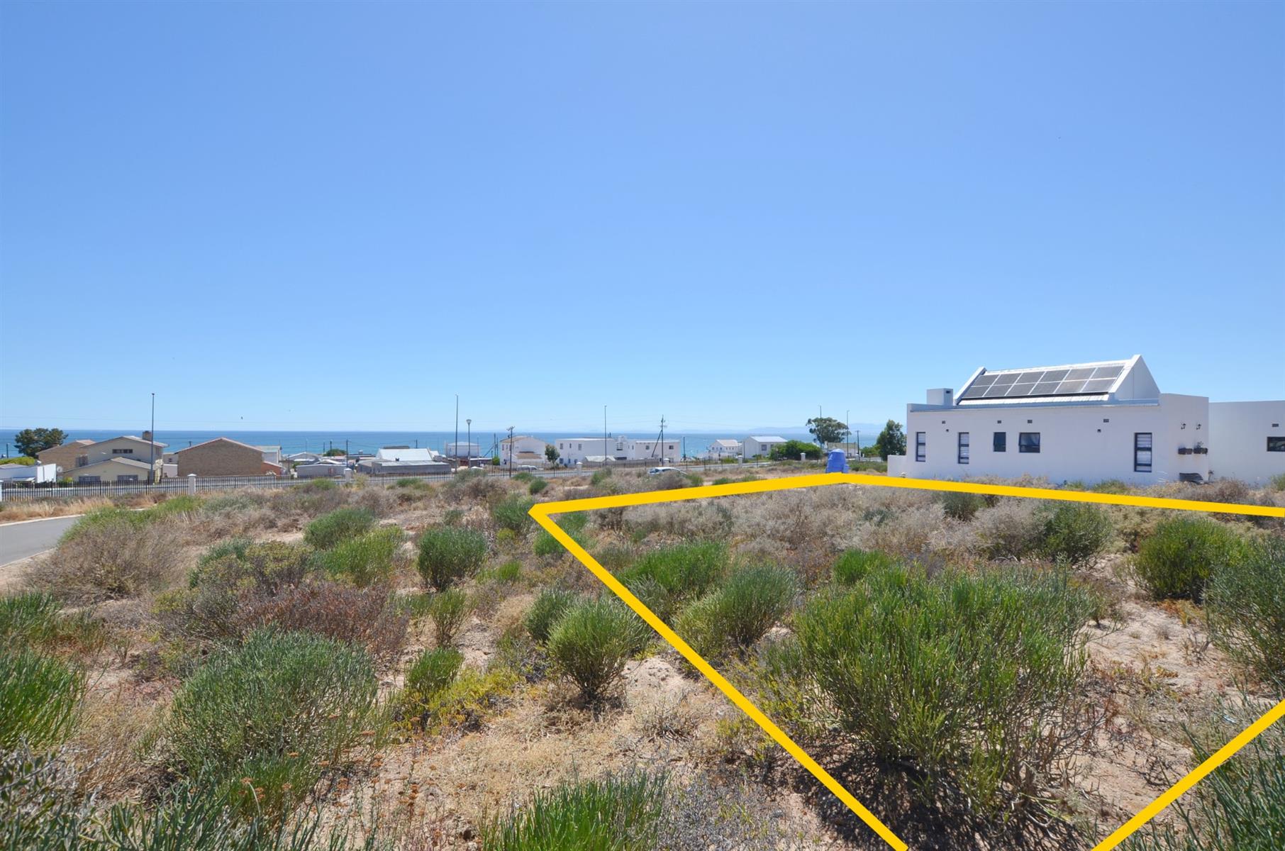 Prime Vacant Land with Design Flexibility in Secure Coastal Village