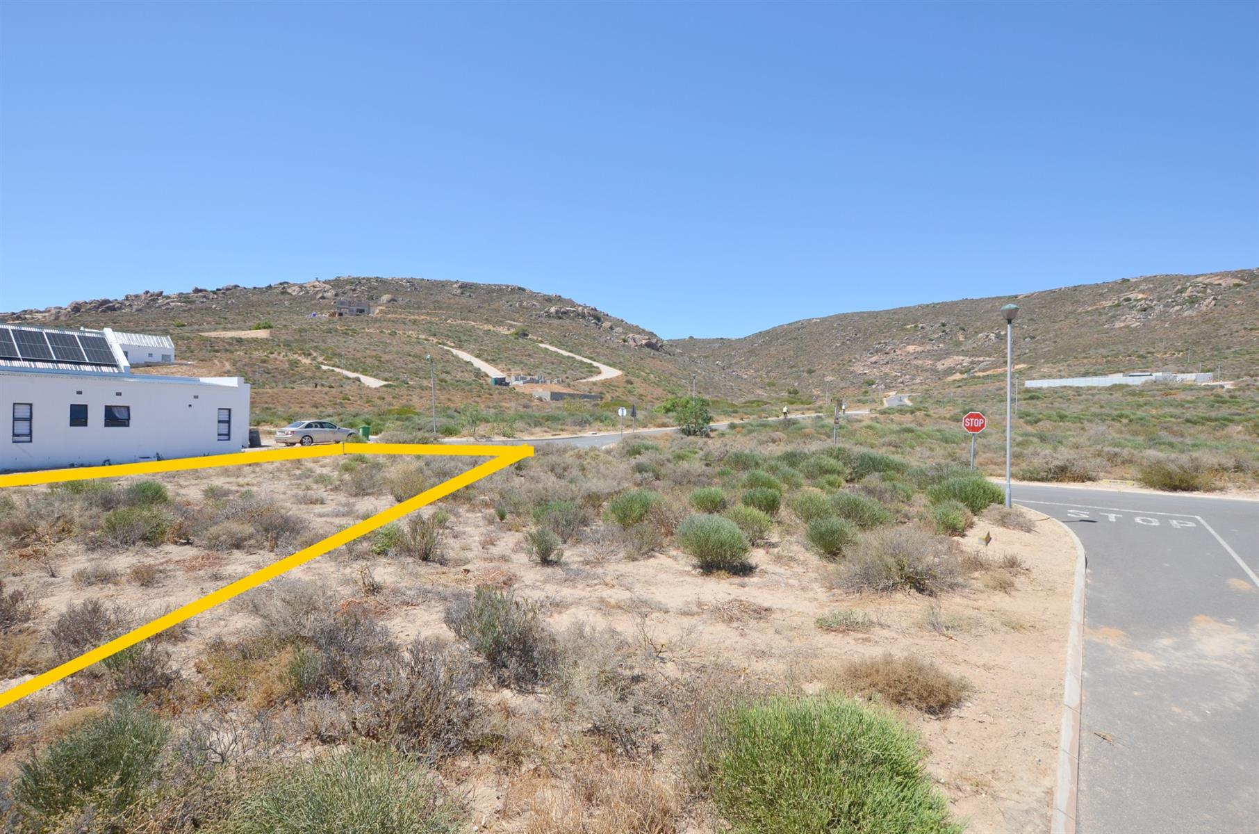 Prime Vacant Land with Design Flexibility in Secure Coastal Village