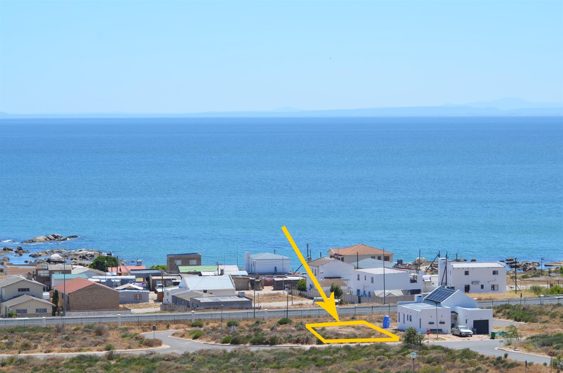 Prime Vacant Land with Design Flexibility in Secure Coastal Village
