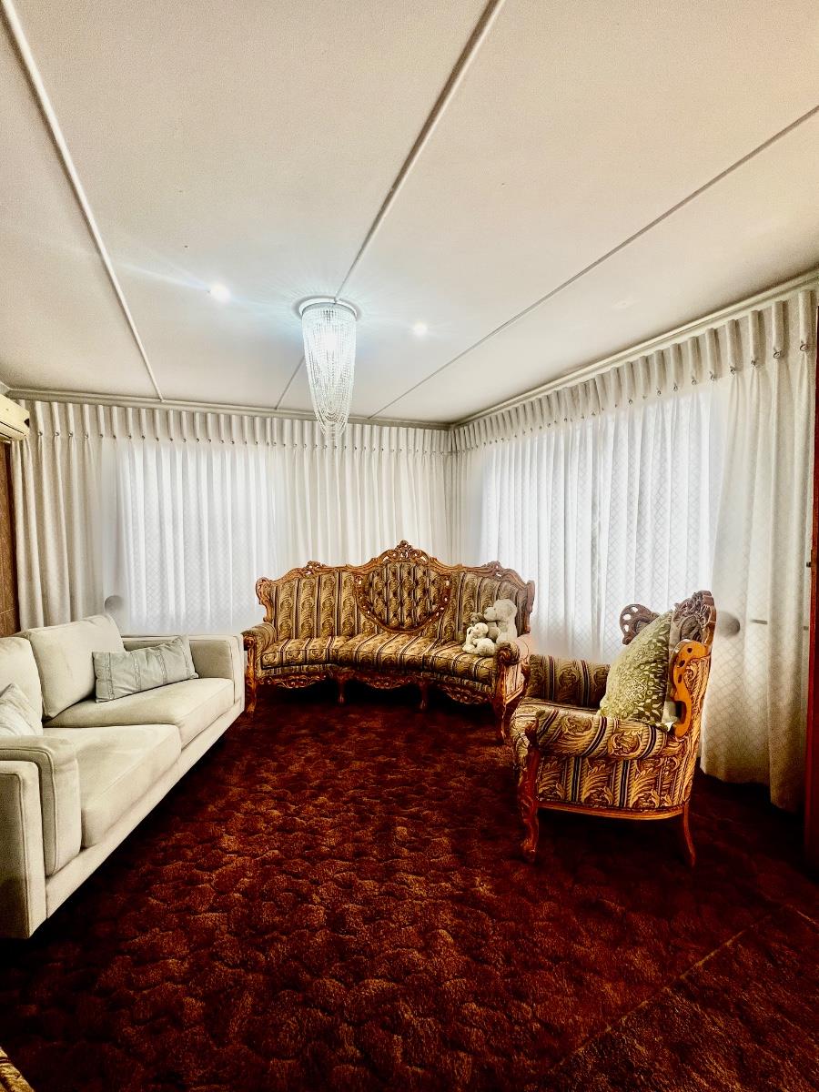 Well-Maintained 3 bedroom home with 2 bedroom flatlet and secure yard