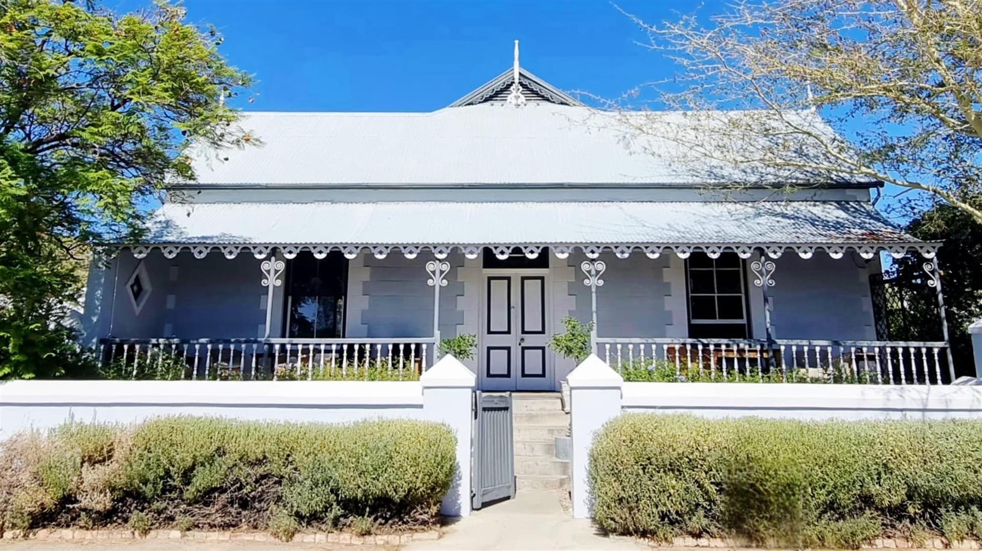 Timeless Victorian Elegance with Lush Gardens and Income-Generating Cottage