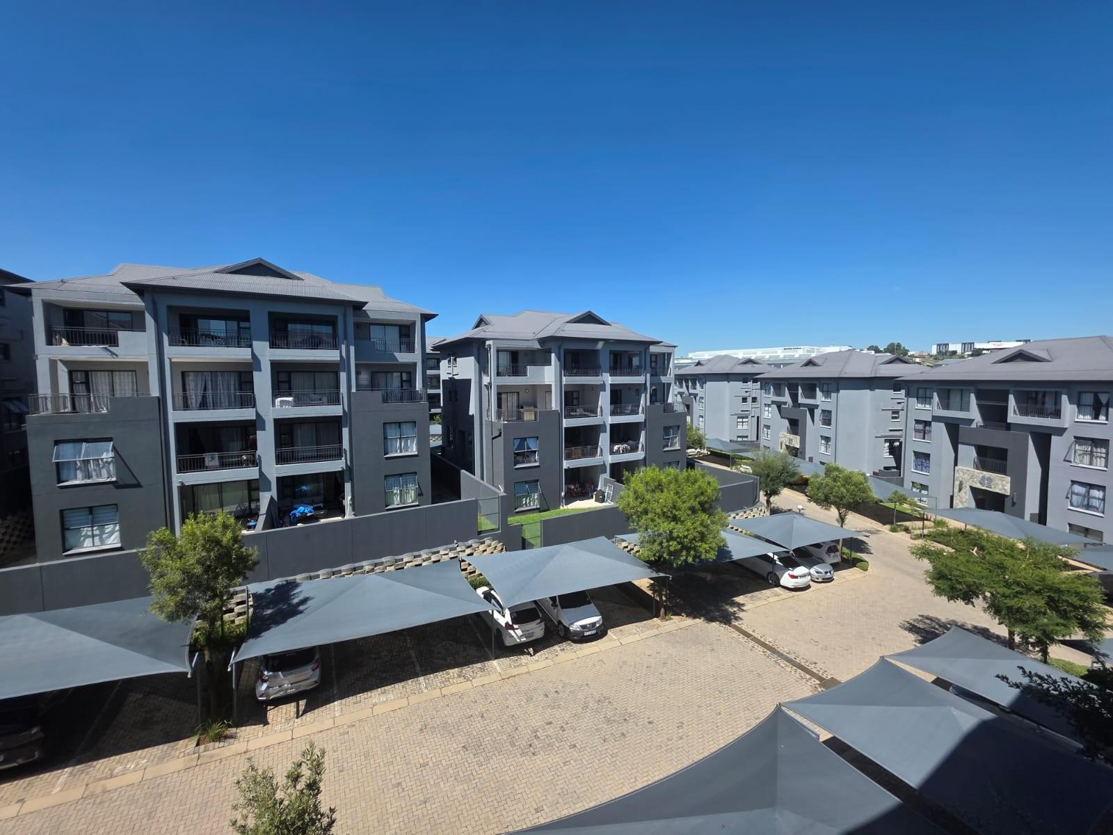 Bright, Modern Apartment with Expansive Balcony in sought after Lifestyle Complex