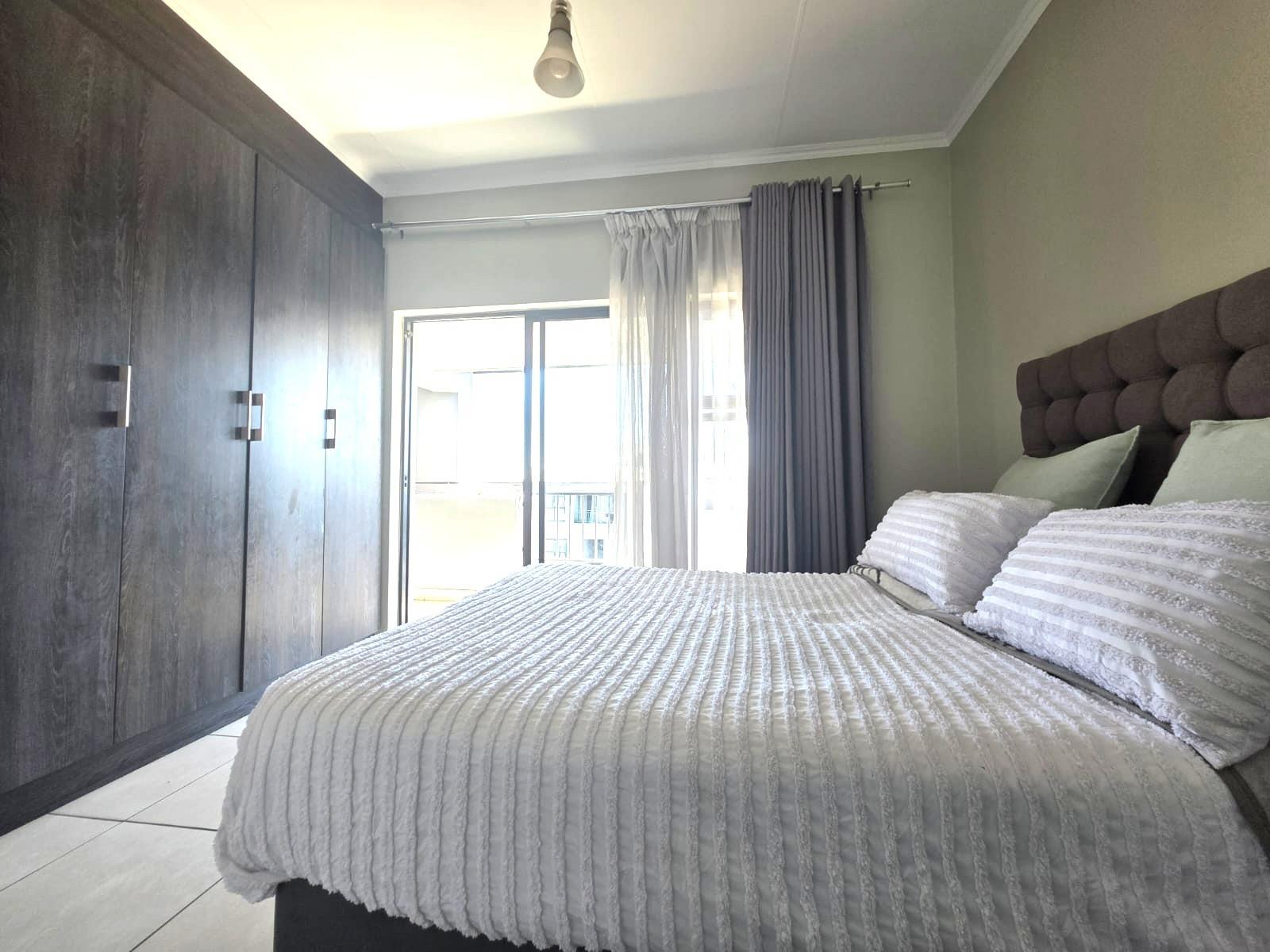 Bright, Modern Apartment with Expansive Balcony in sought after Lifestyle Complex
