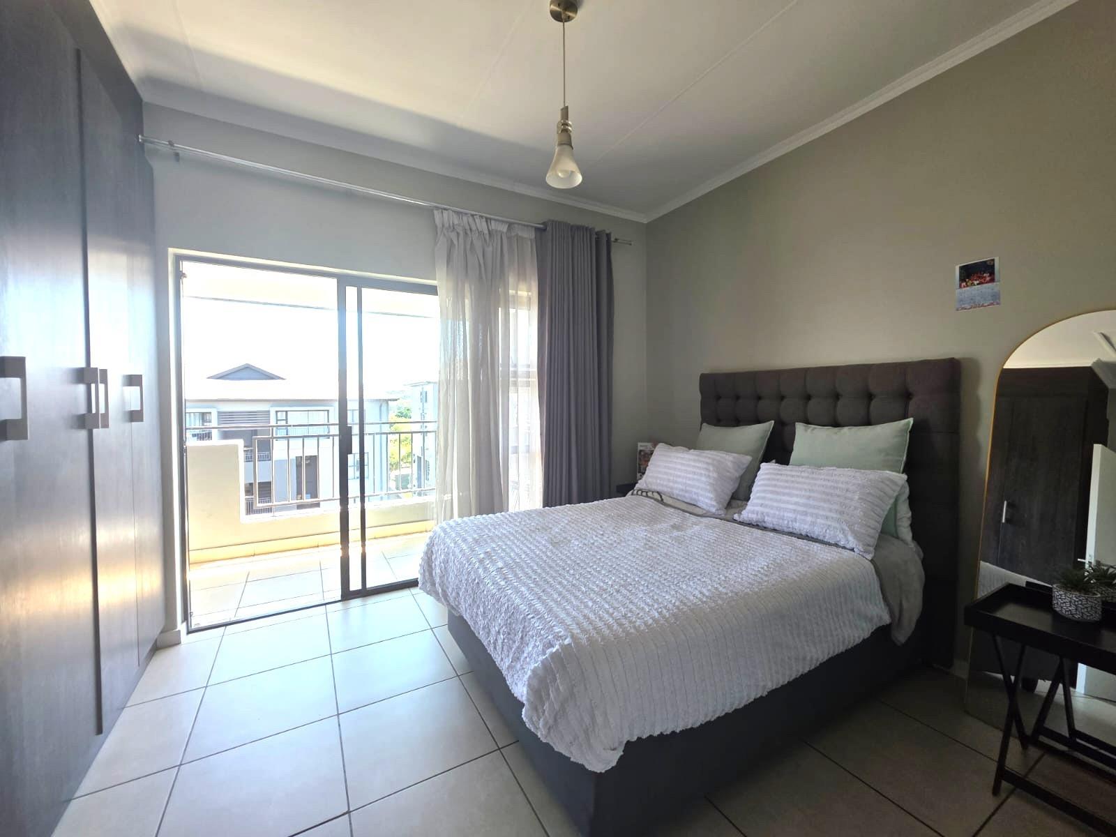 Bright, Modern Apartment with Expansive Balcony in sought after Lifestyle Complex