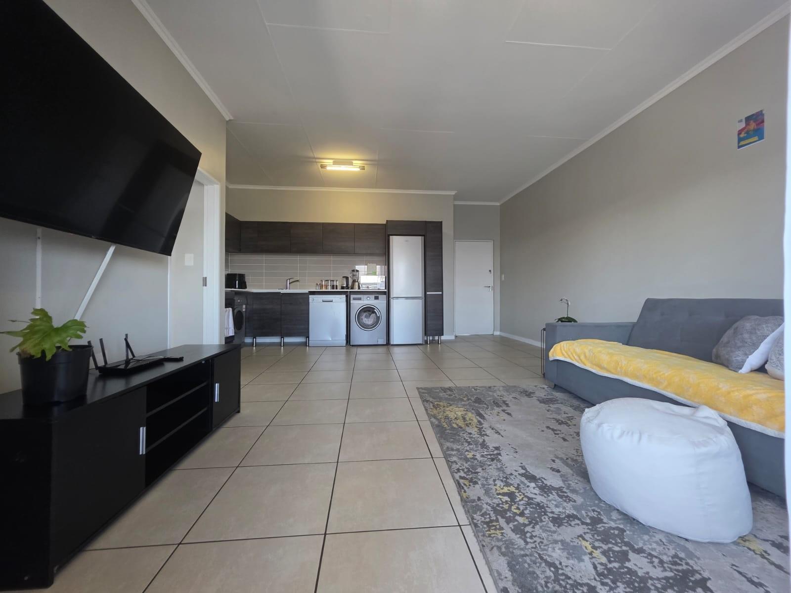 Bright, Modern Apartment with Expansive Balcony in sought after Lifestyle Complex