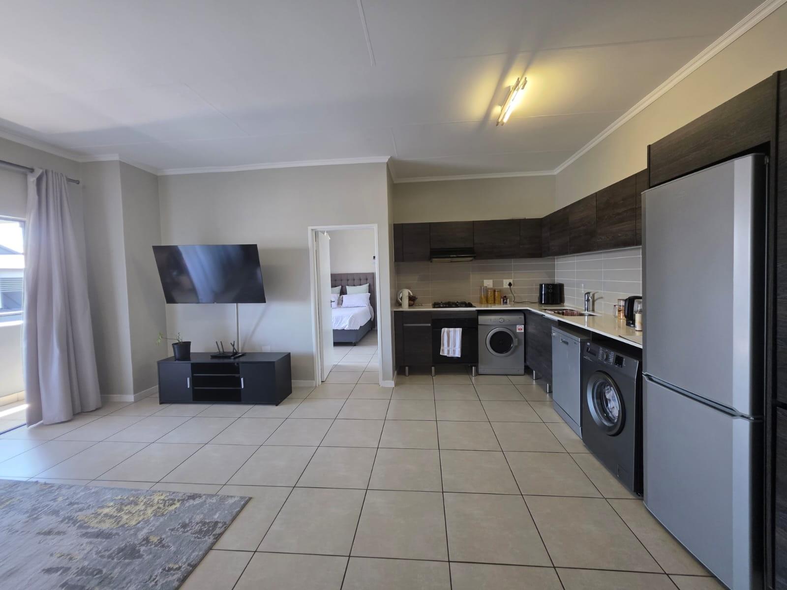 Bright, Modern Apartment with Expansive Balcony in sought after Lifestyle Complex