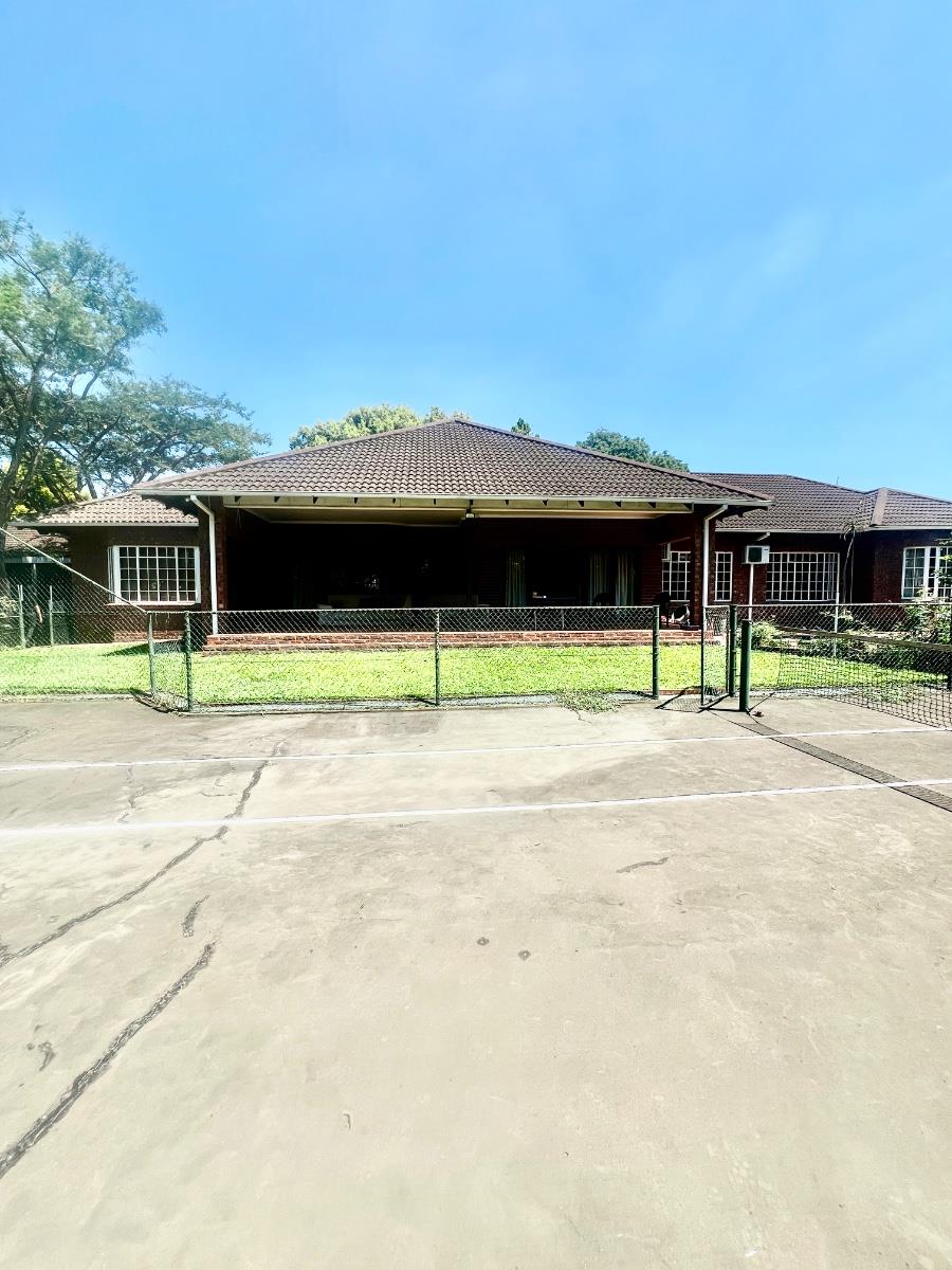 Exceptional lifestyle home with tennis court, entertainment wing, pool, and flatlet