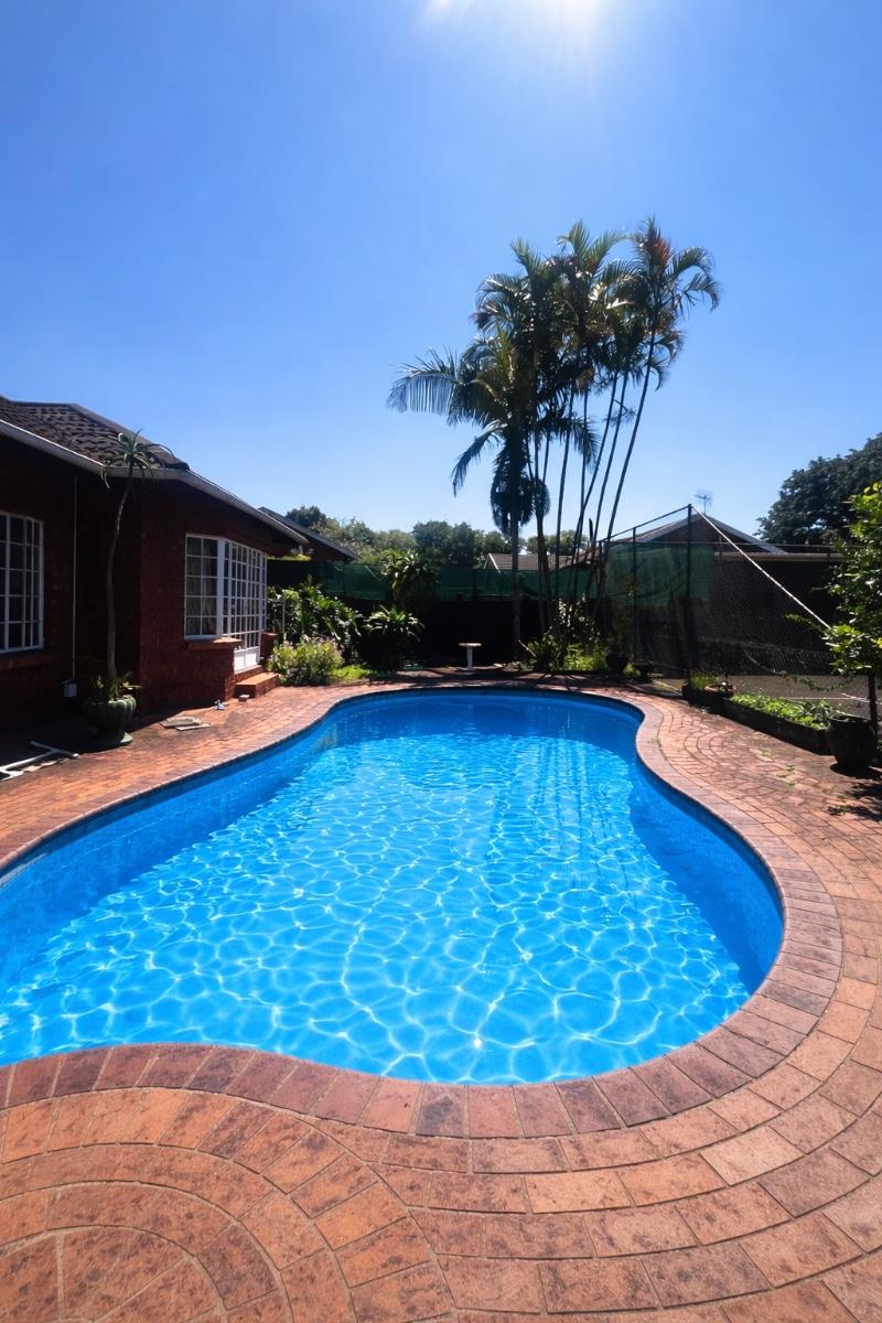 Exceptional lifestyle home with tennis court, entertainment wing, pool, and flatlet