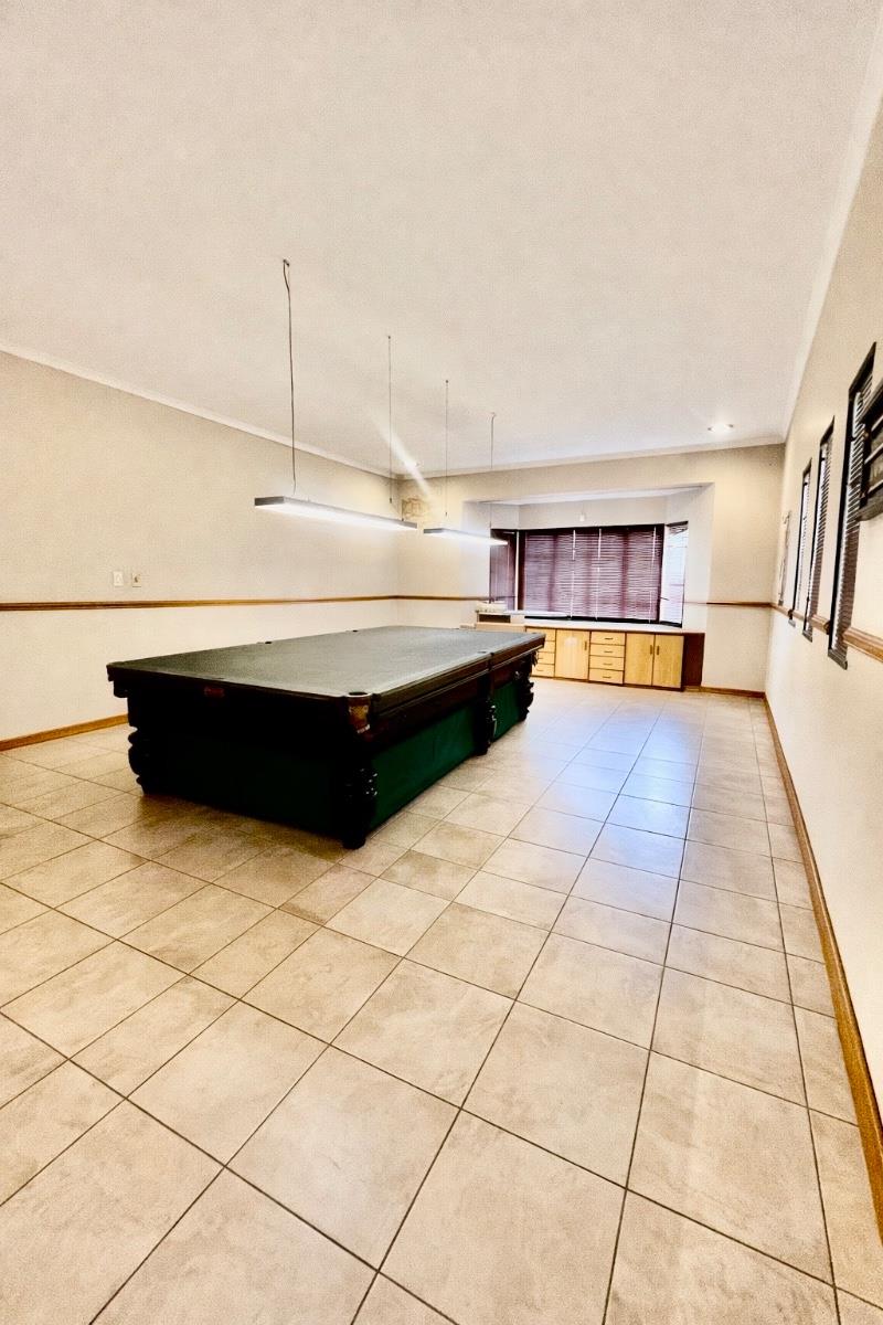 Exceptional lifestyle home with tennis court, entertainment wing, pool, and flatlet