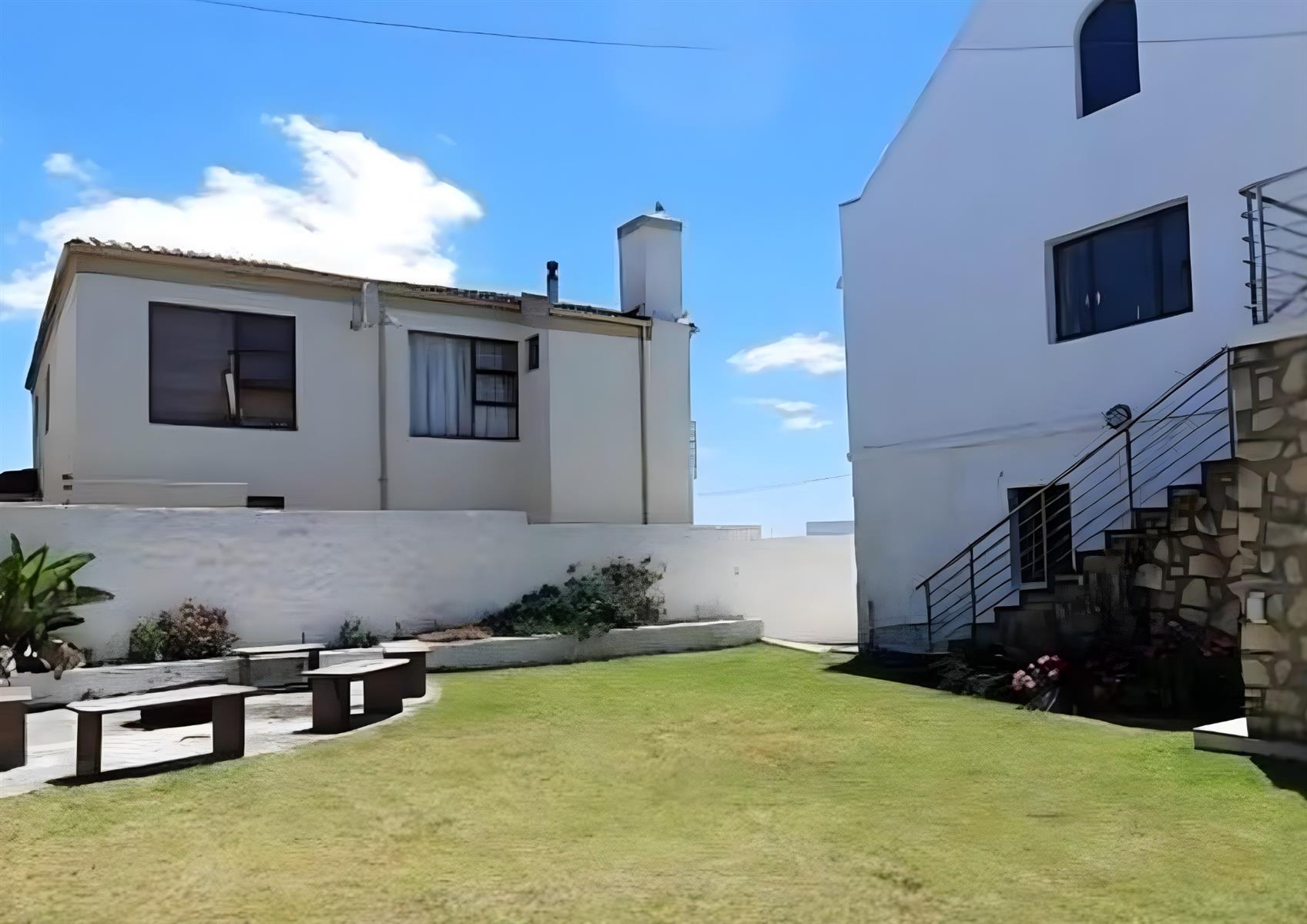 Coastal Elegance Redefined: A Lavish 4-Bedroom Holiday Home with Partial Sea Views in Arniston