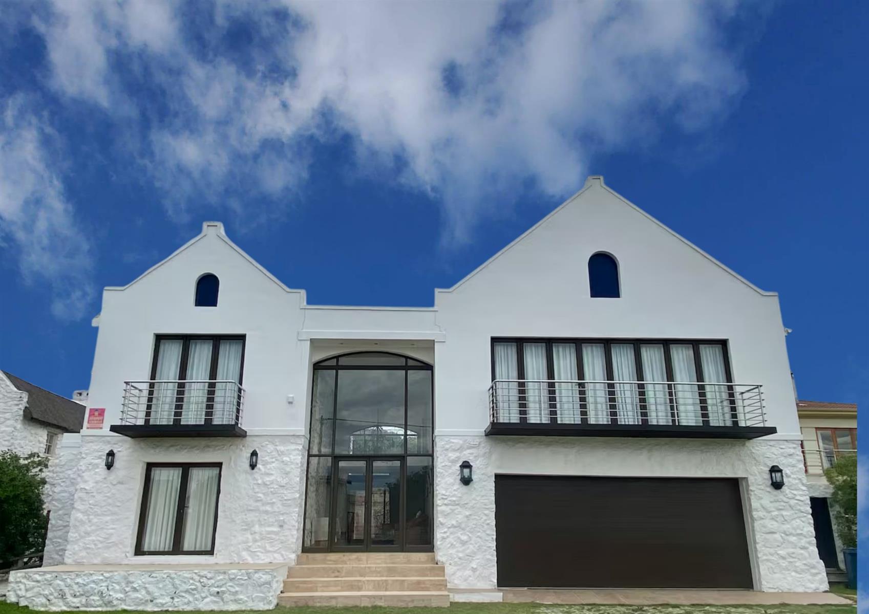 Coastal Elegance Redefined: A Lavish 4-Bedroom Holiday Home with Partial Sea Views in Arniston