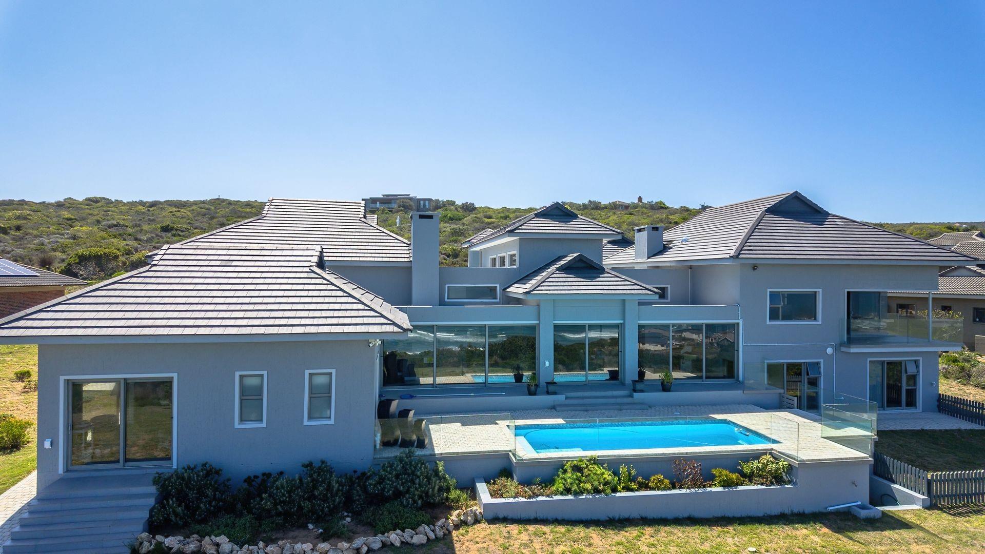 Luxury Coastal Investment Opportunity with Breathtaking White-Water Ocean Views!