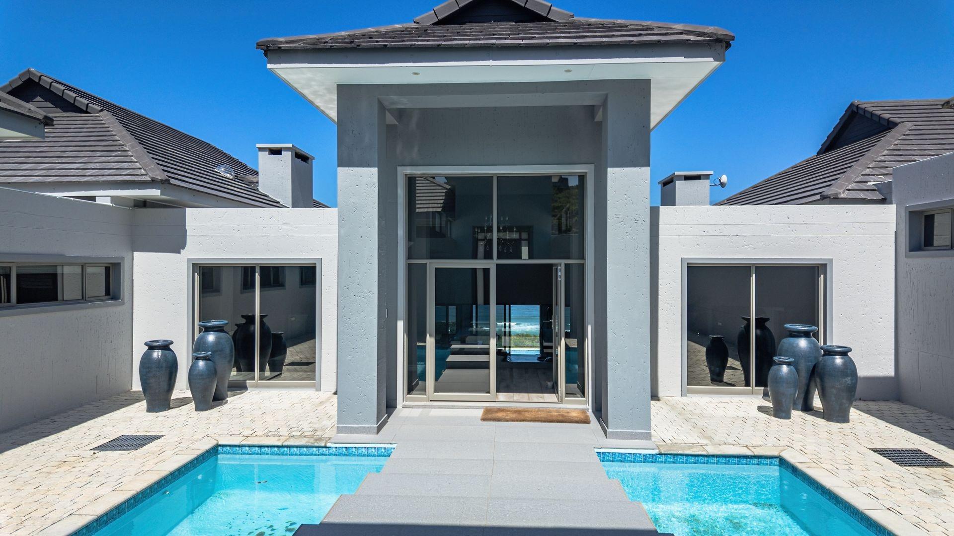 Luxury Coastal Investment Opportunity with Breathtaking White-Water Ocean Views!