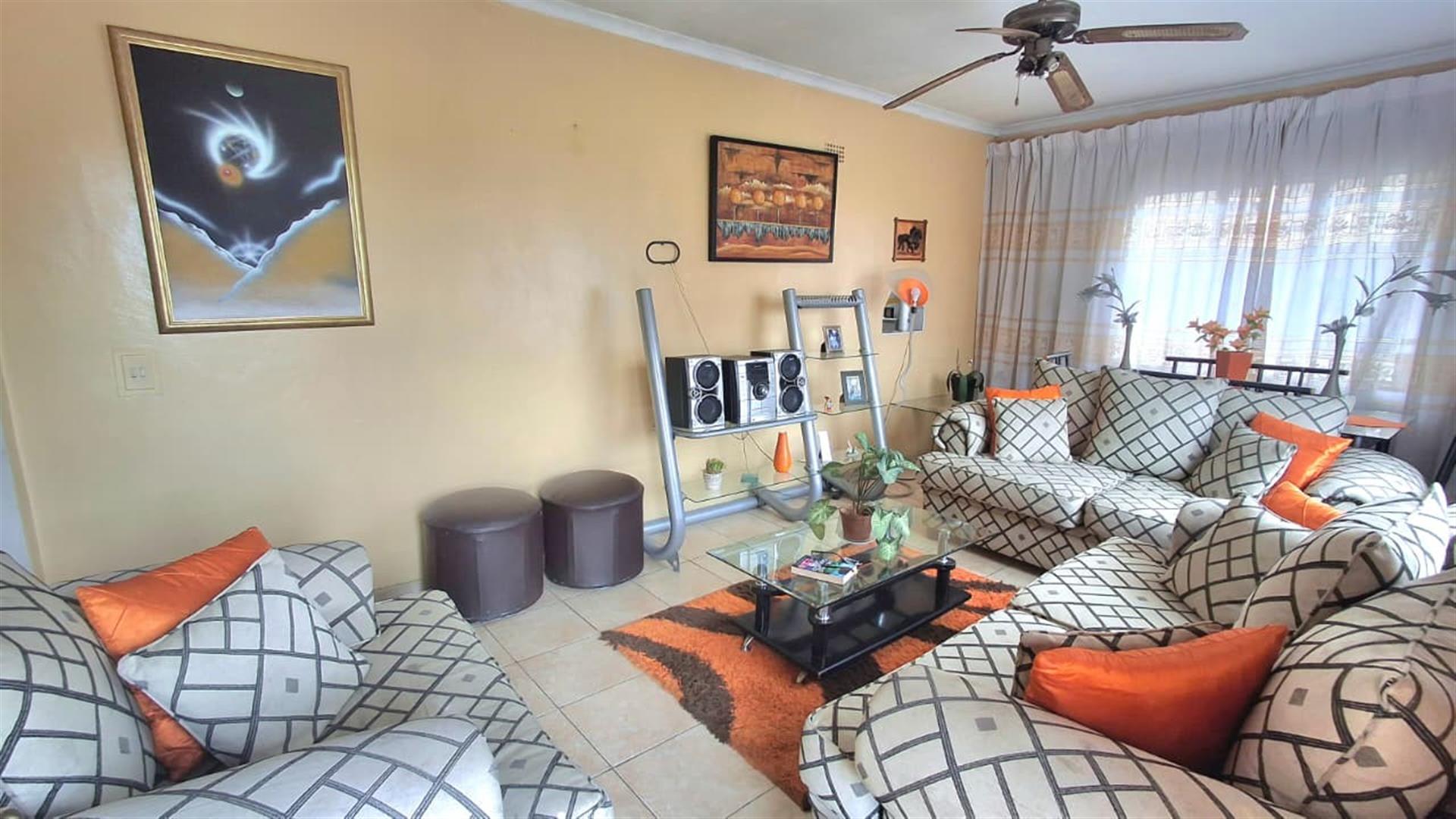 Spacious 3-Bedroom Family Home with Extra Living Area and Secure Yard Parking