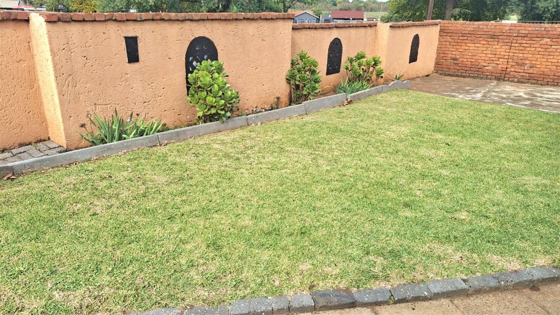 Spacious 3-Bedroom Family Home with Extra Living Area and Secure Yard Parking