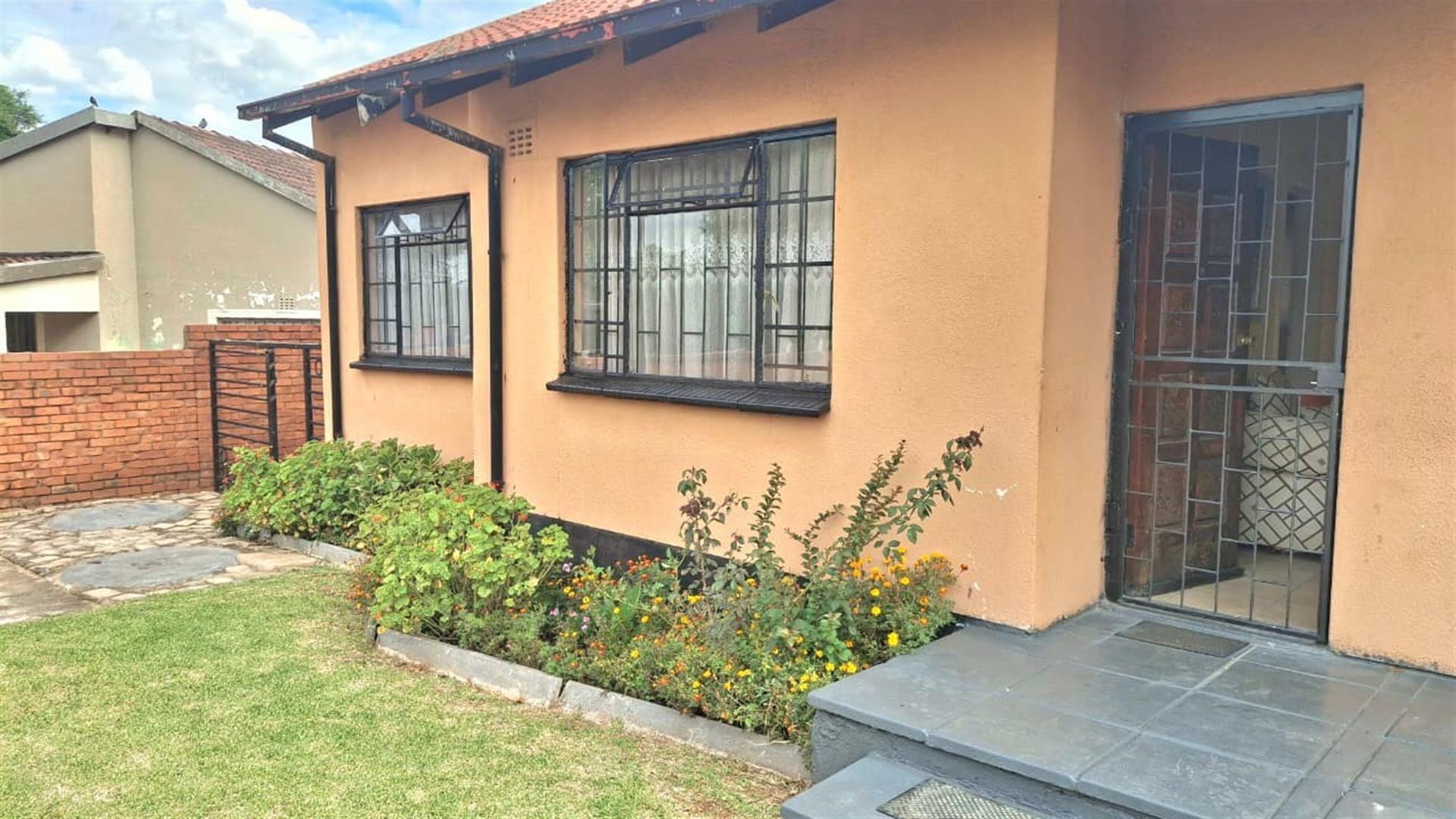Spacious 3-Bedroom Family Home with Extra Living Area and Secure Yard Parking