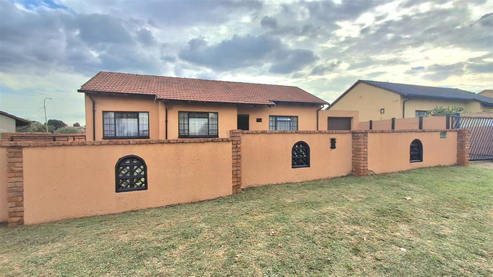 Spacious 3-Bedroom Family Home with Extra Living Area and Secure Yard Parking