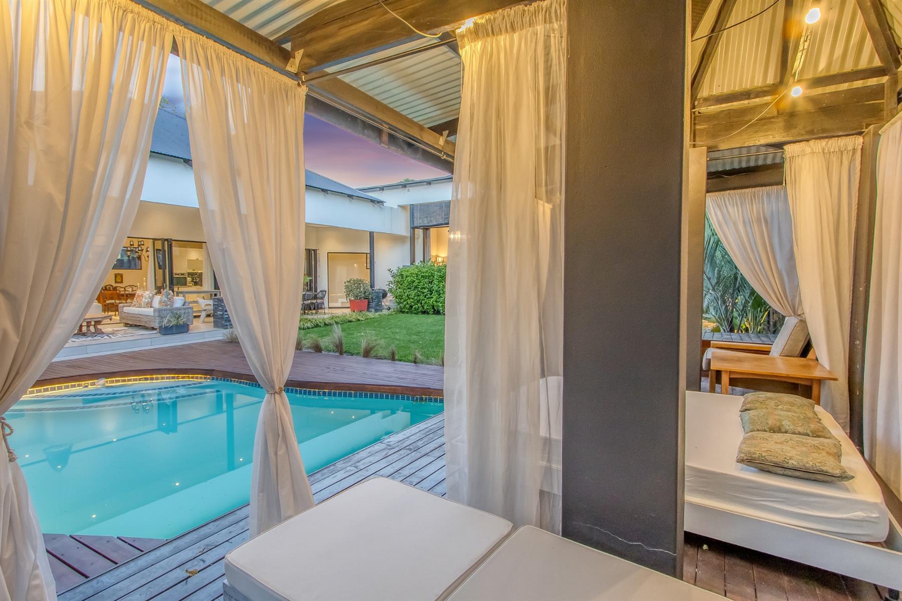 Spacious Bali-inspired designer home with pool, solar and elegant entertaining spaces