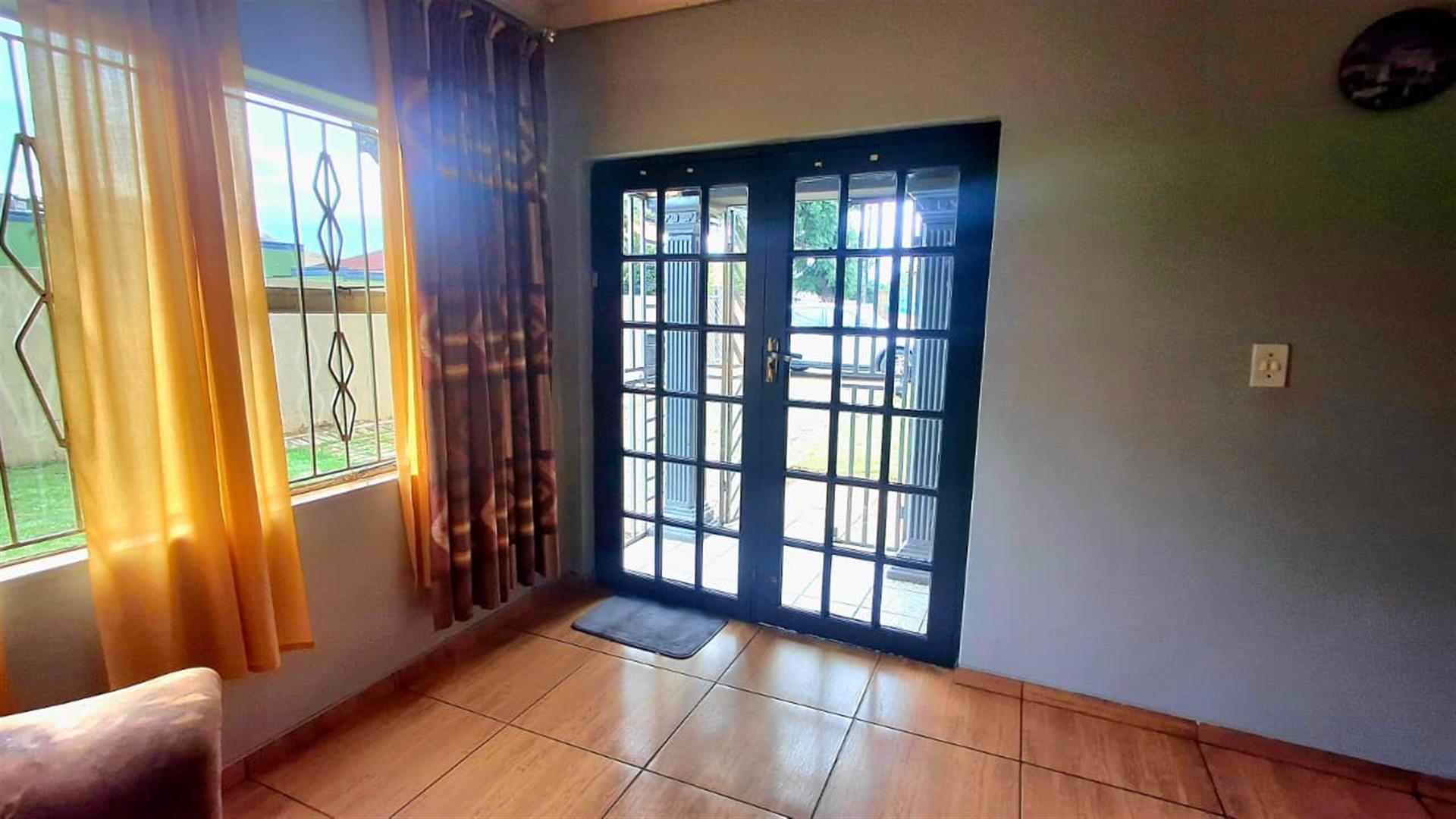 Income-Generating Property: 3-Bedroom House + 2-Bed Flat + Bachelor Unit on Double Stand