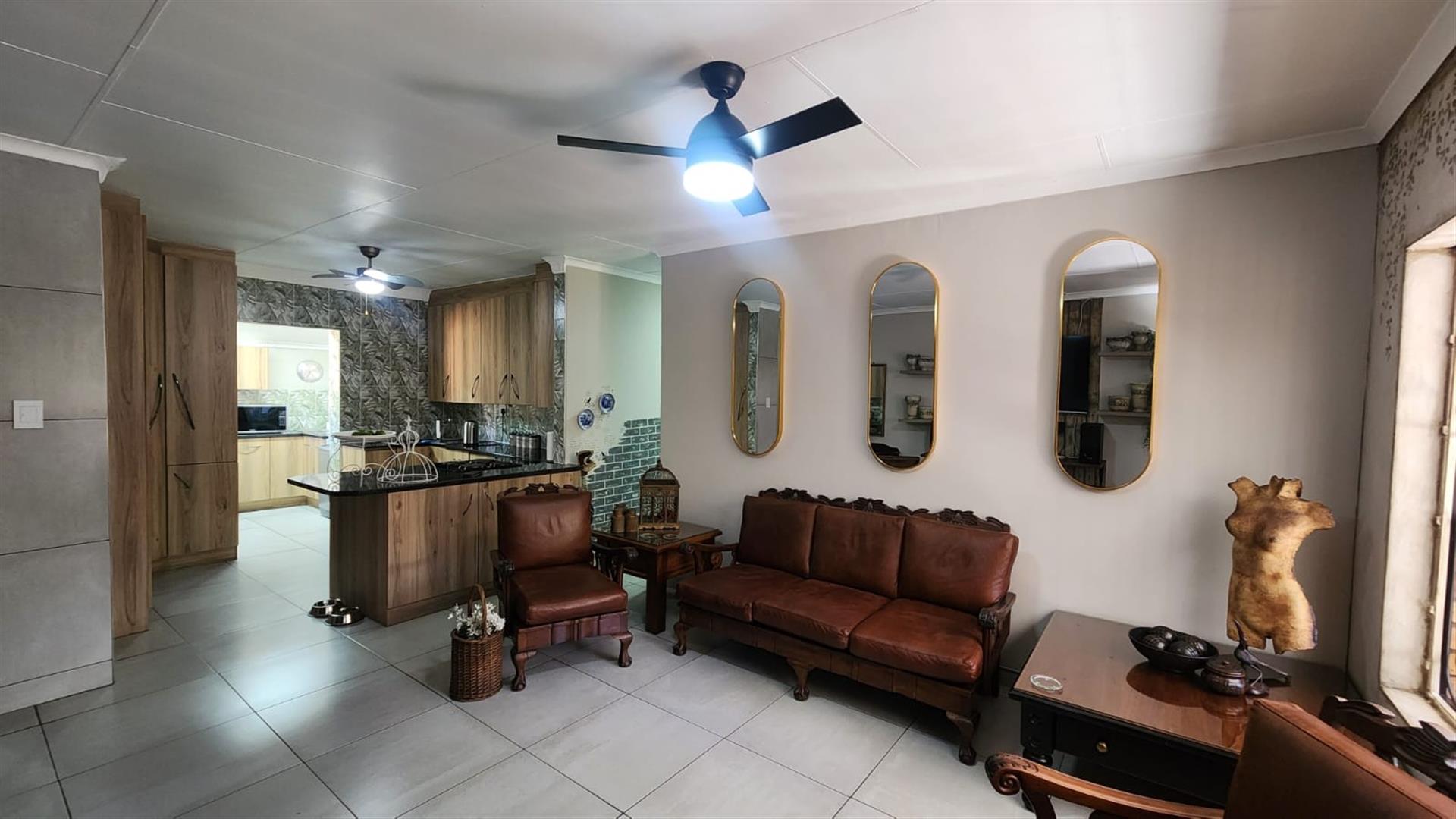Modern Comfort and Secure Living in Sought-After Pin Oaks
