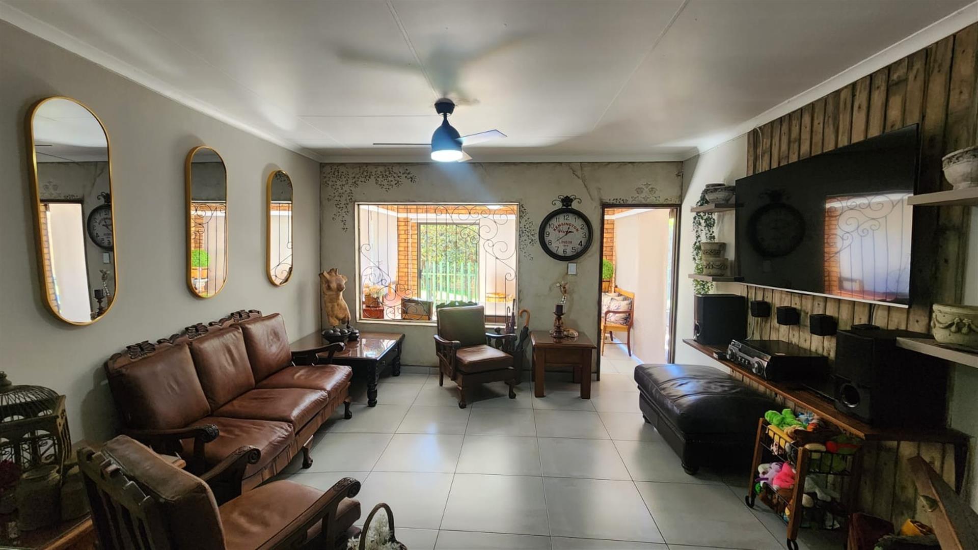 Modern Comfort and Secure Living in Sought-After Pin Oaks