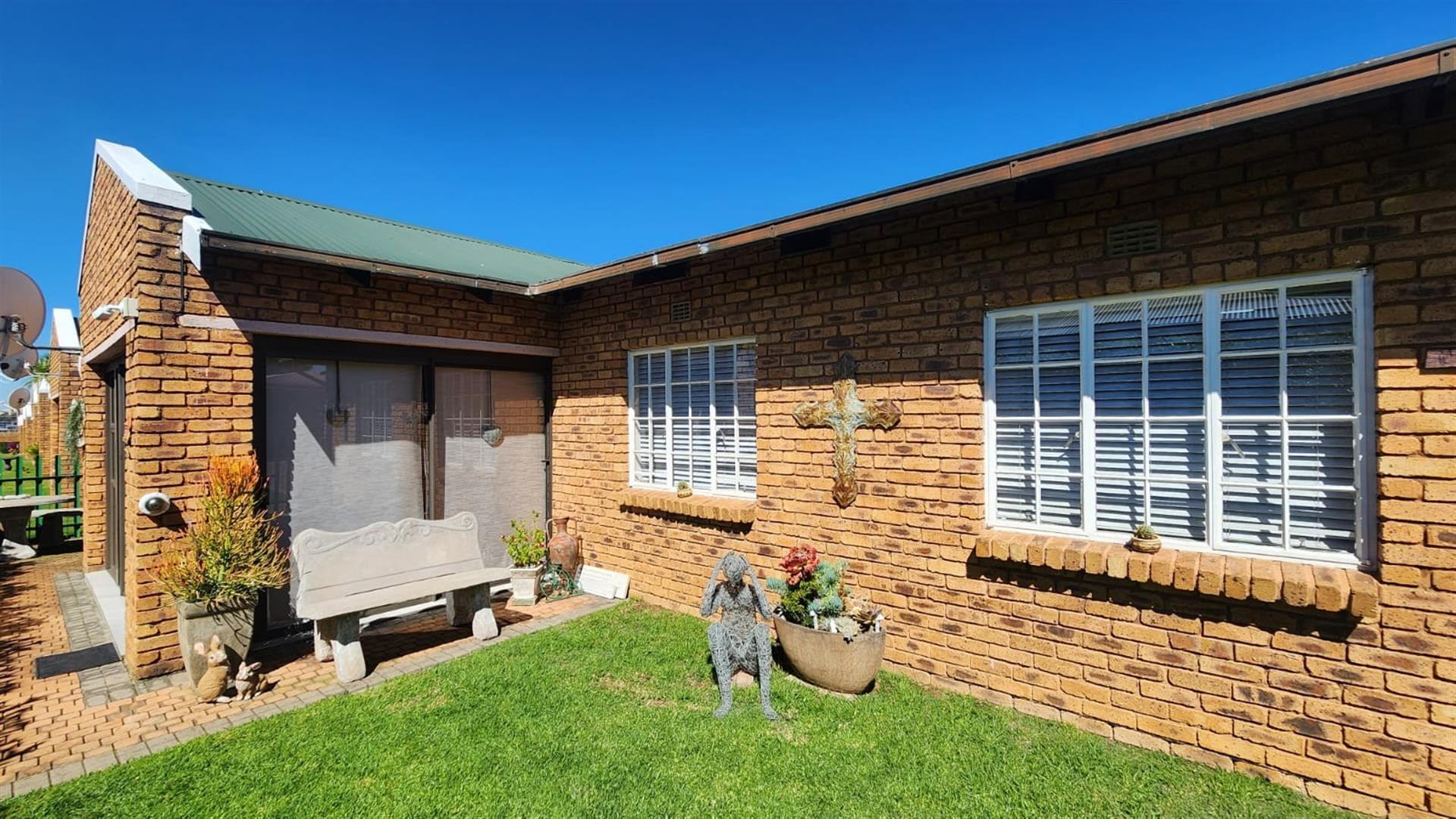 Modern Comfort and Secure Living in Sought-After Pin Oaks